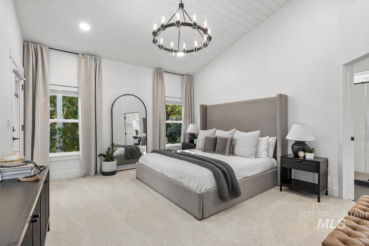 Bedroom with light colored carpet, recessed lighting, a chandelier, wood ceiling, and vaulted ceiling