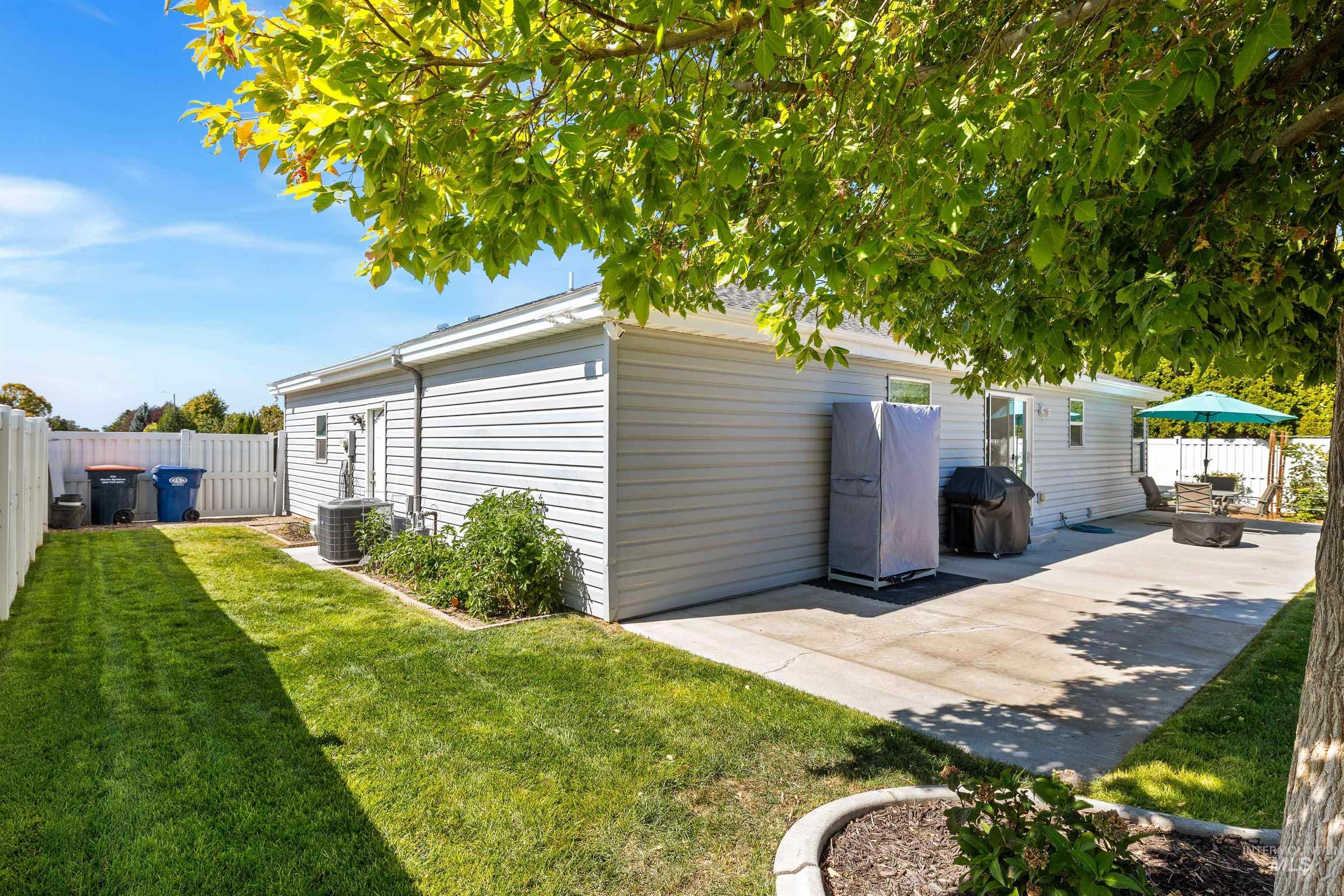 View of outdoor structure with a fenced backyard and a gazebo