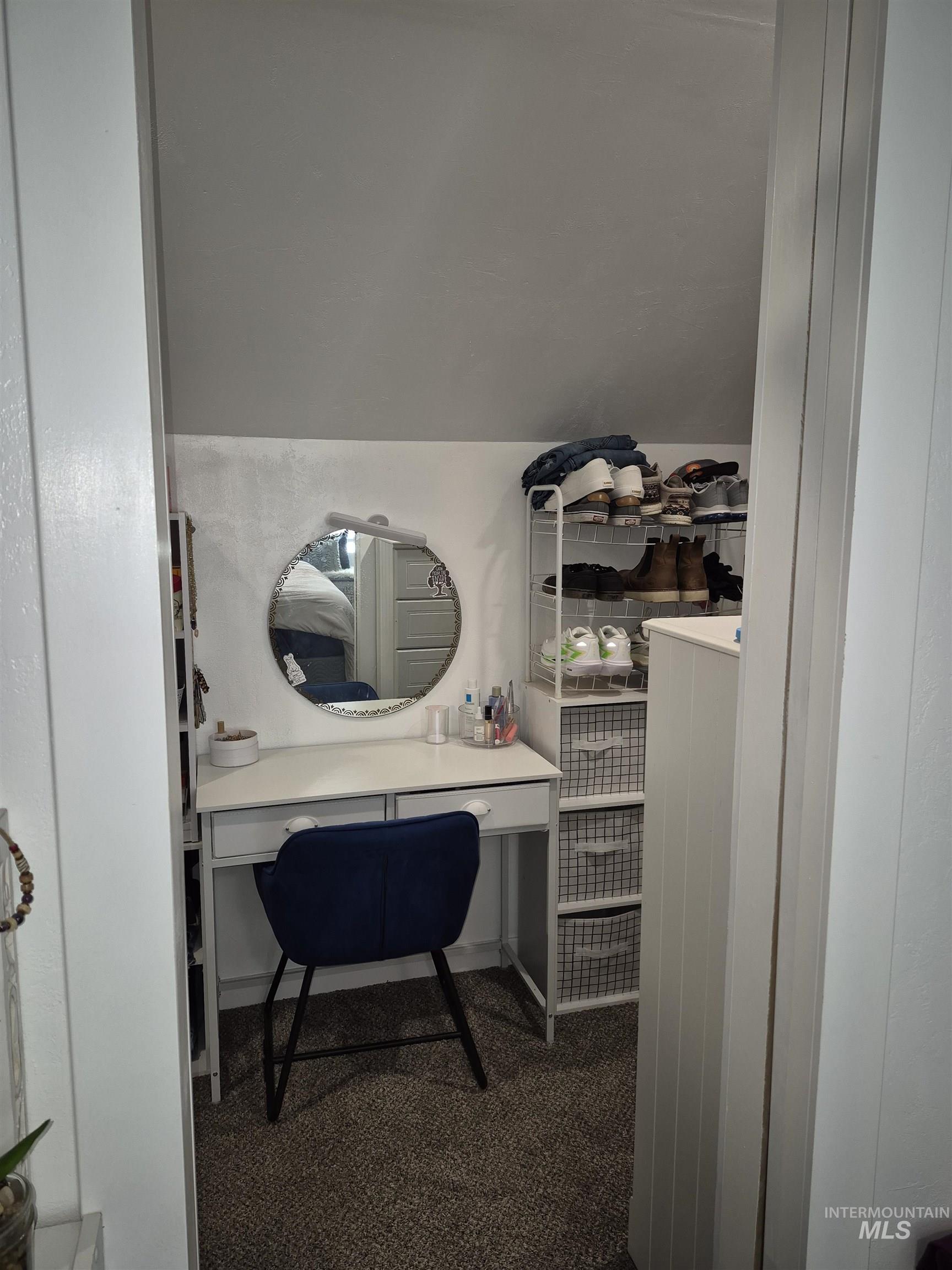 Bathroom featuring vaulted ceiling