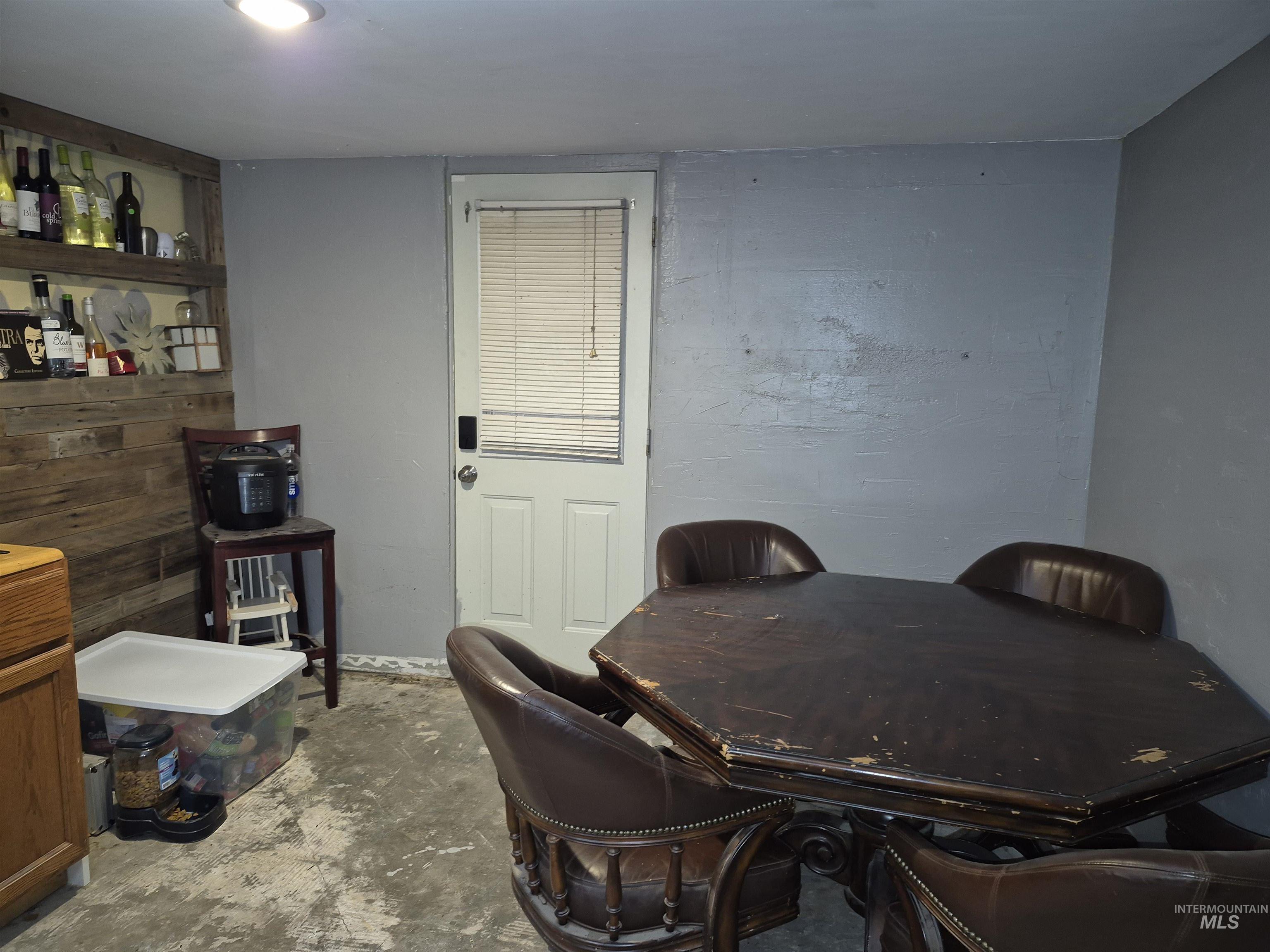 Dining area featuring concrete flooring