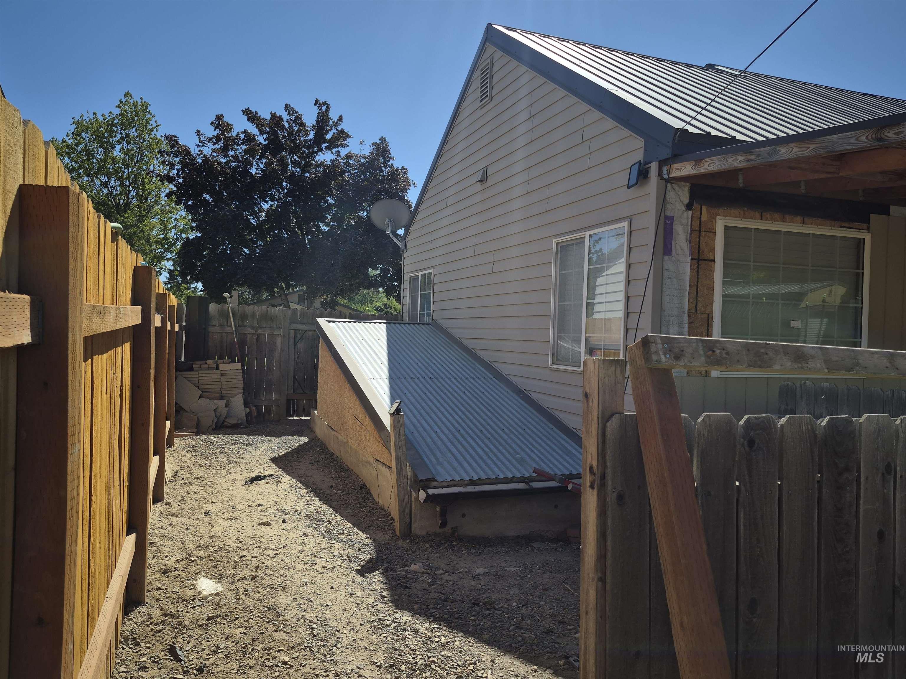 View of home's exterior featuring a metal roof