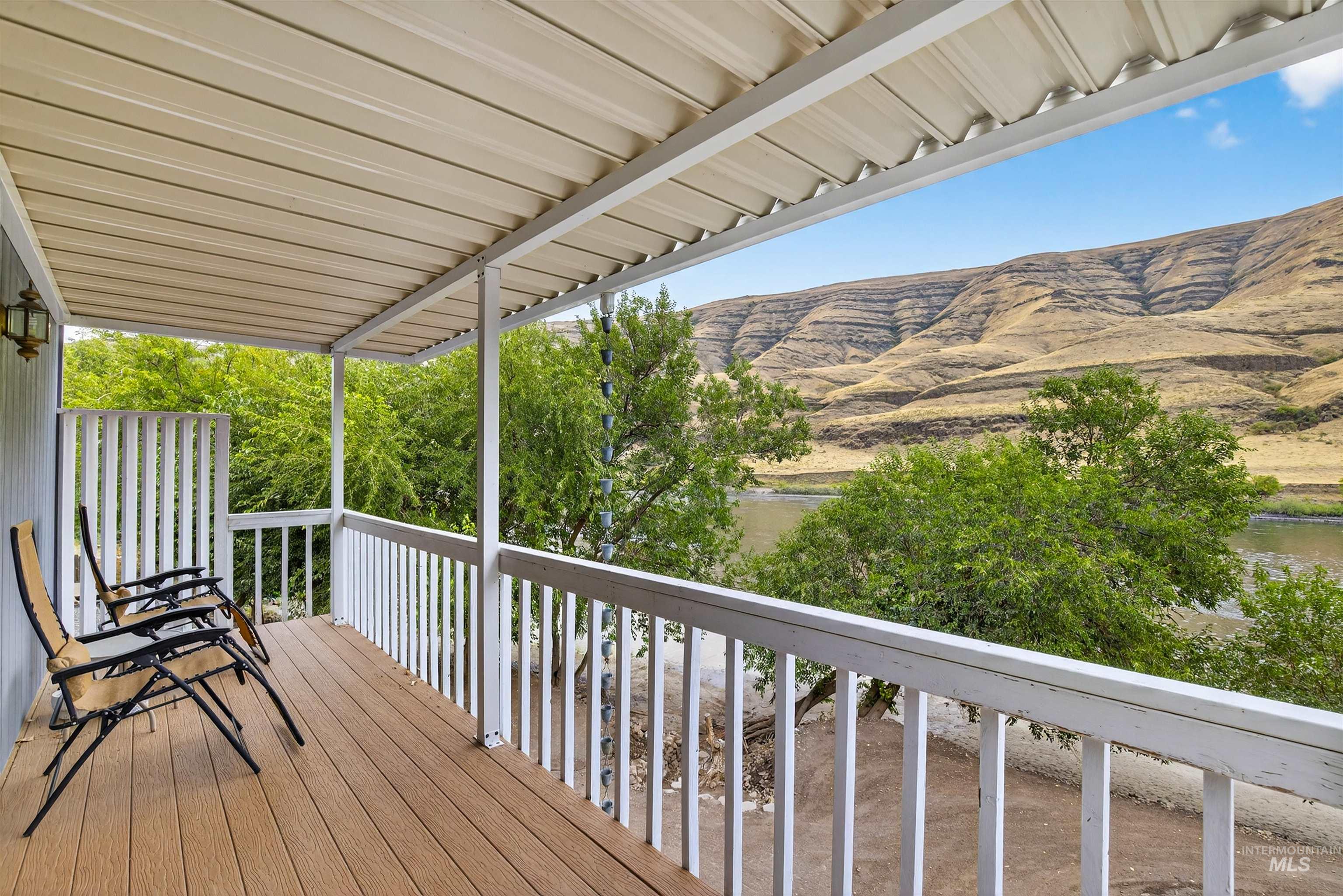 Wooden deck featuring a mountain view