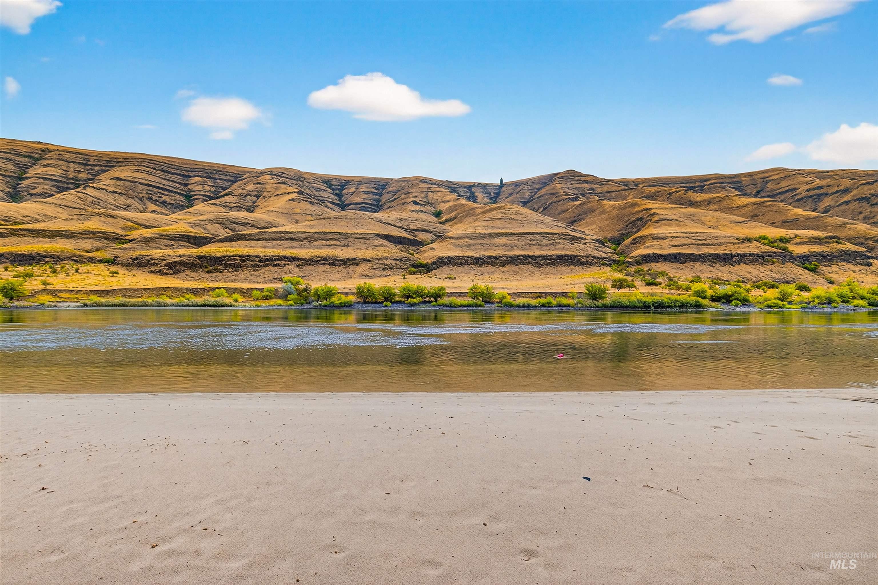 View of mountain backdrop featuring a large body of water
