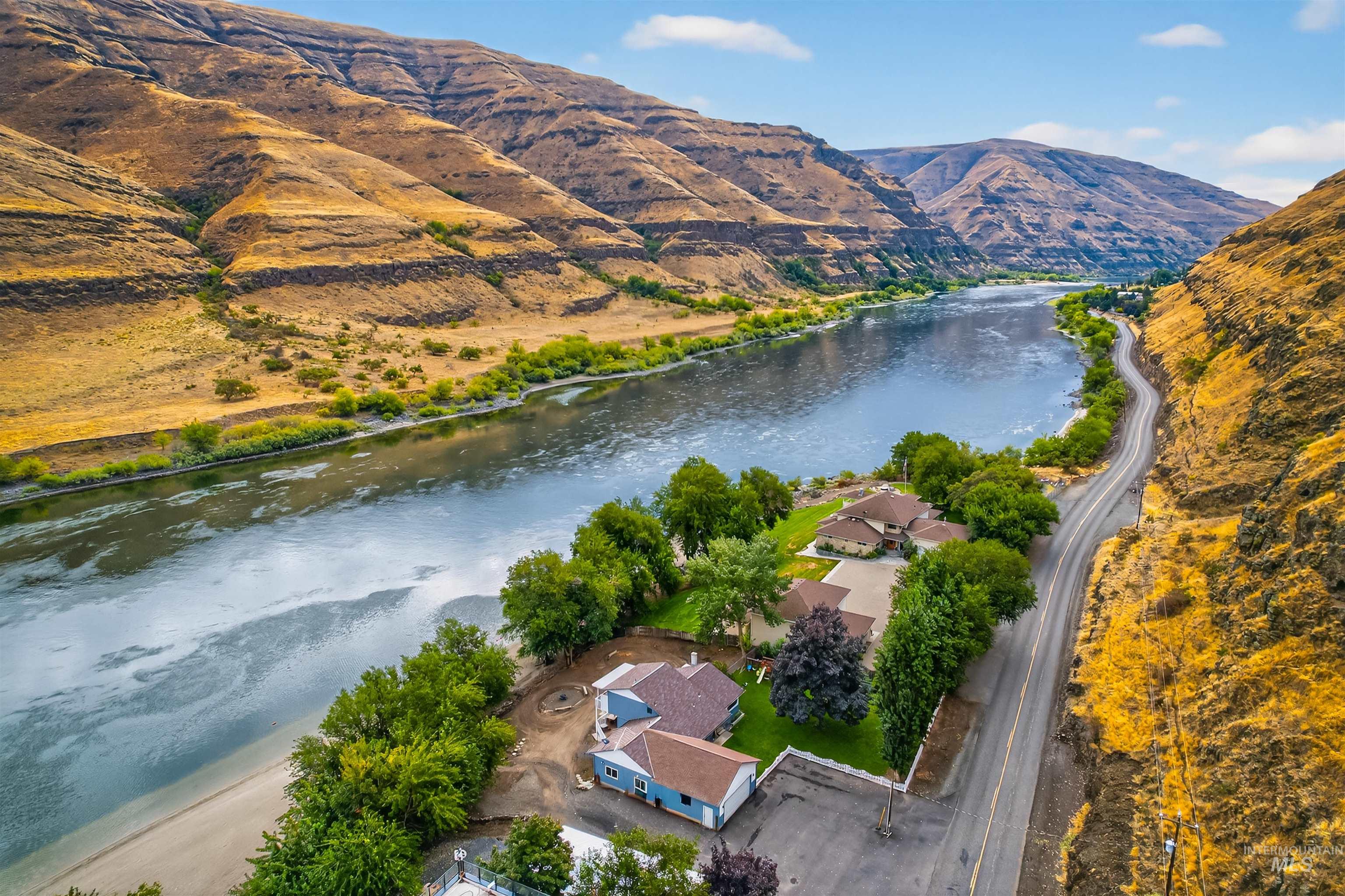 Aerial overview of property's location with a water and mountain view