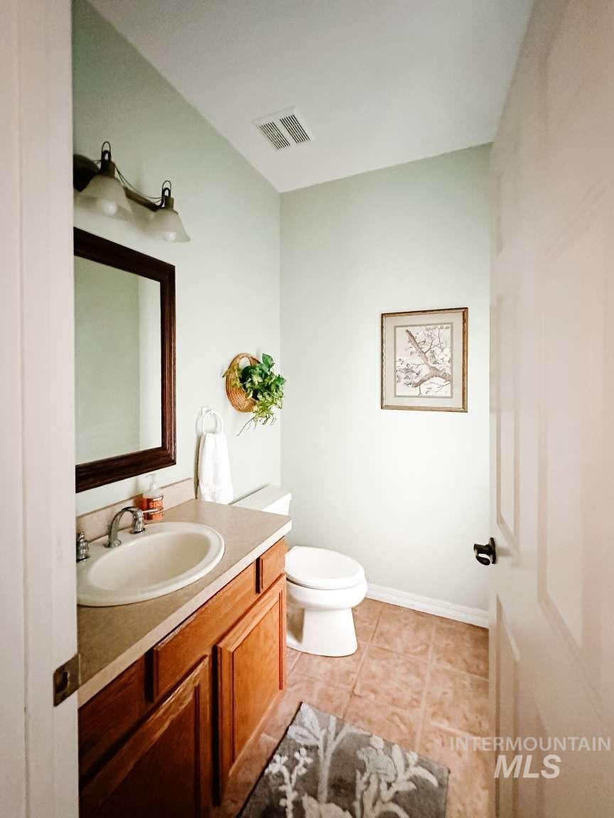 Bathroom with vanity and light tile patterned flooring