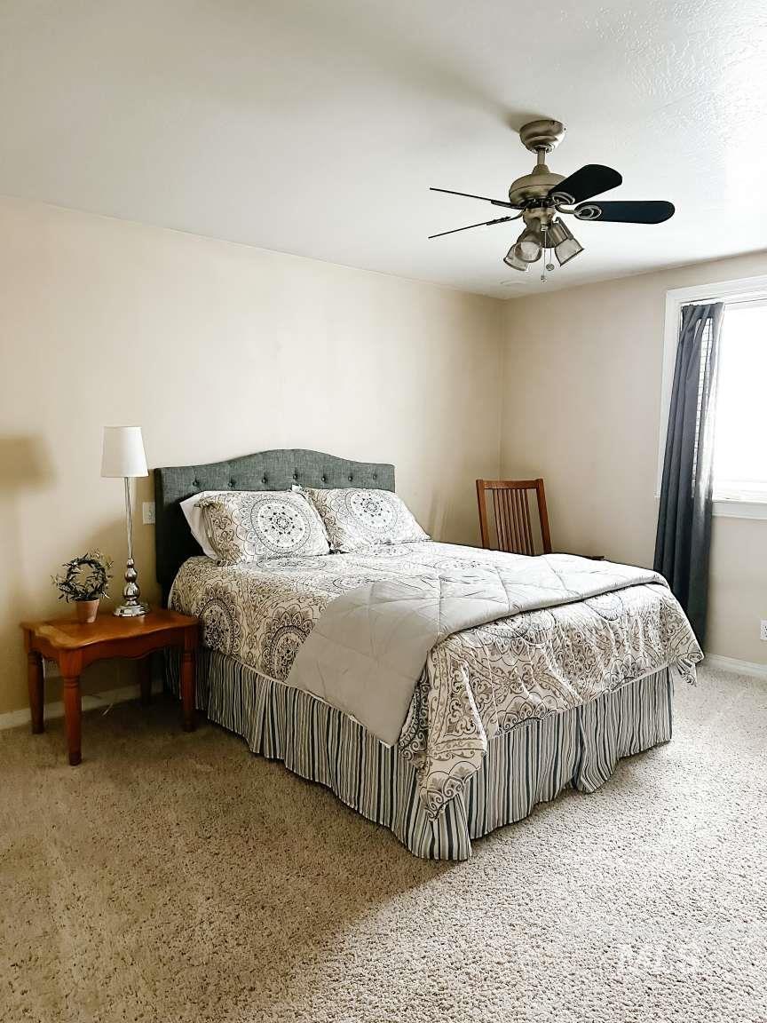 Bedroom with baseboards and a ceiling fan