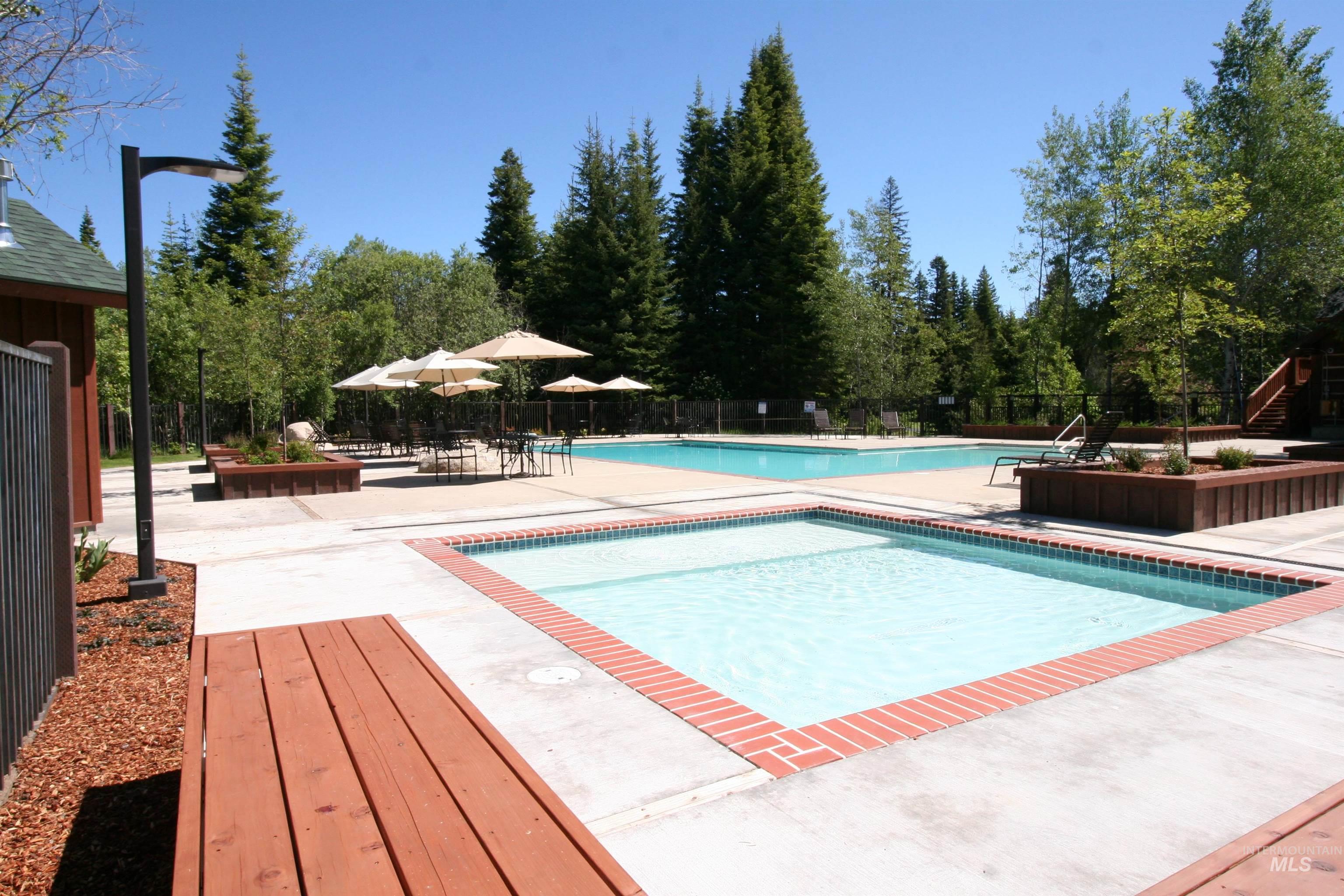 Community pool featuring a patio