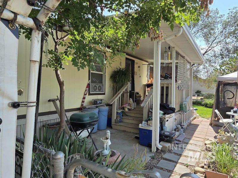 Rear view of property with a patio and a gazebo