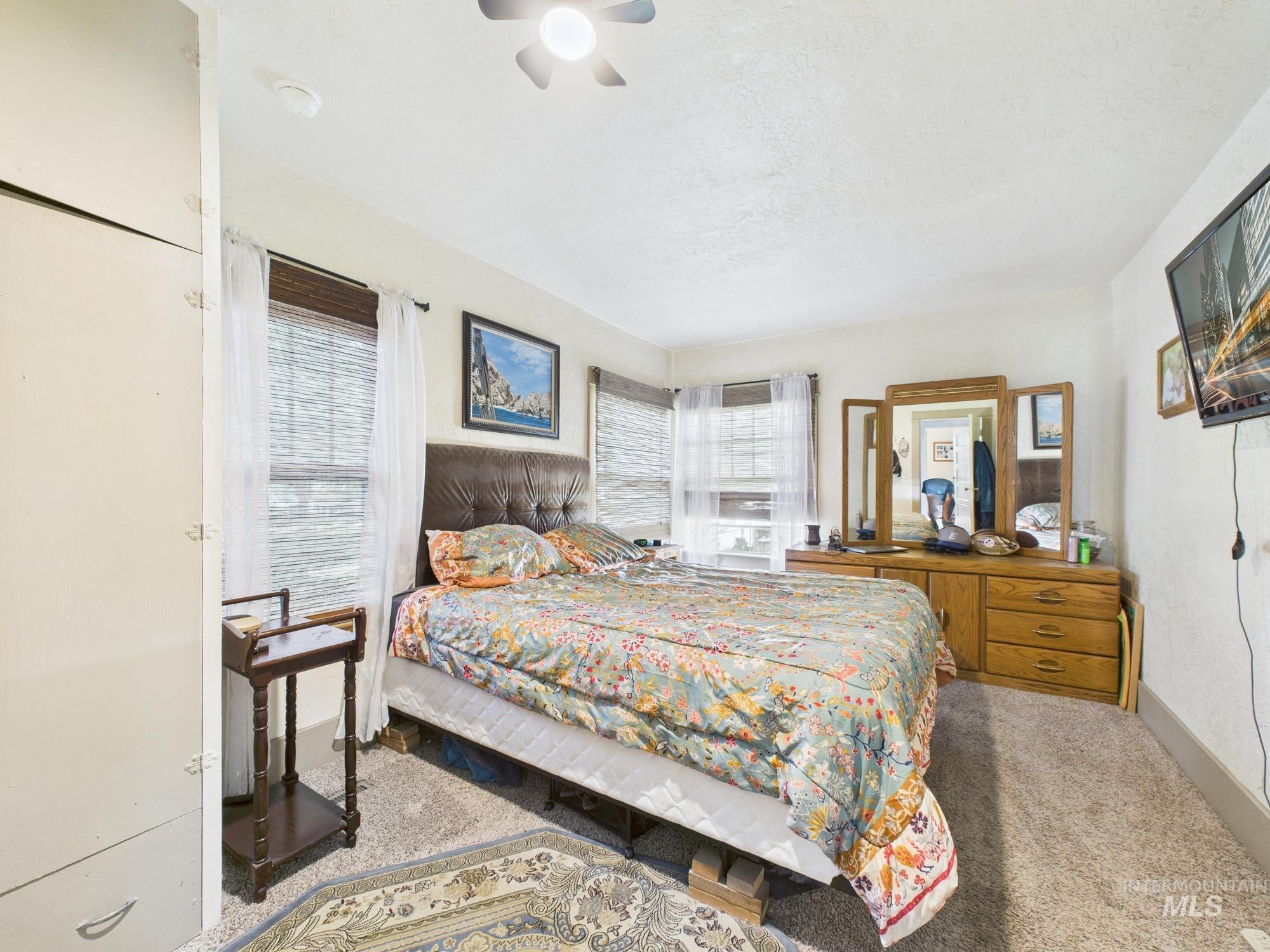 Bedroom featuring carpet floors and ceiling fan