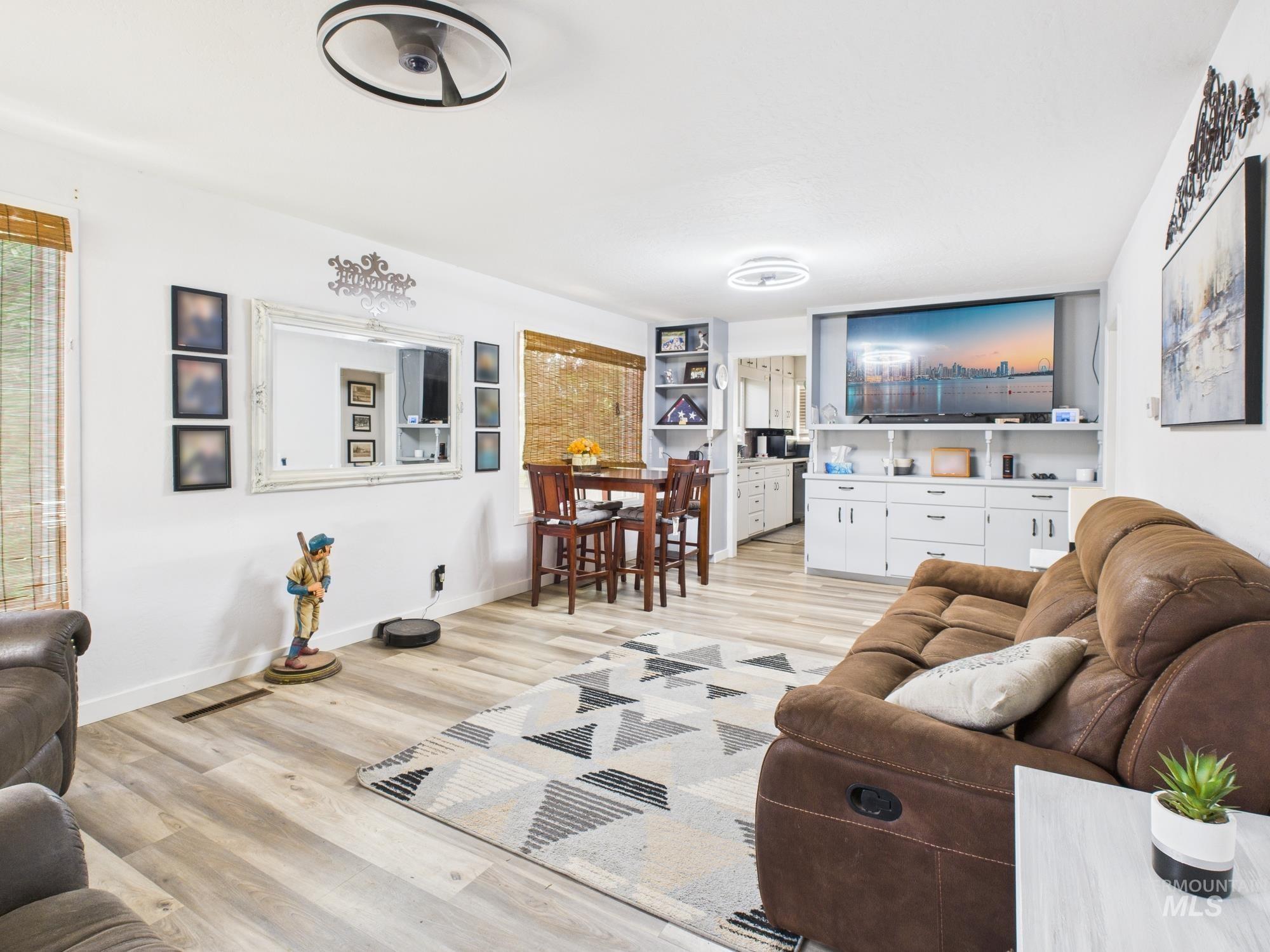 Living area featuring light wood-style flooring