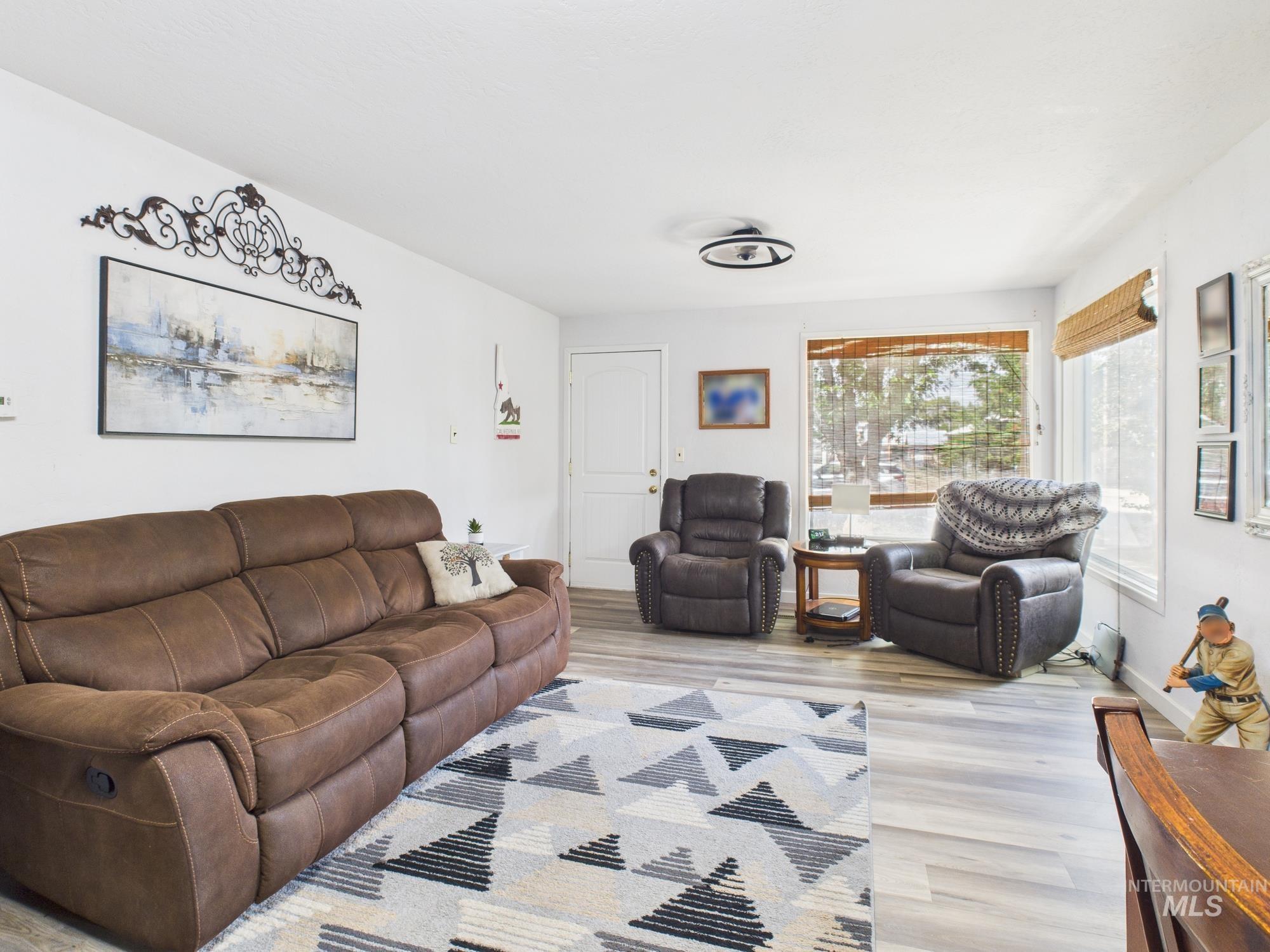 Living area featuring wood finished floors and baseboards