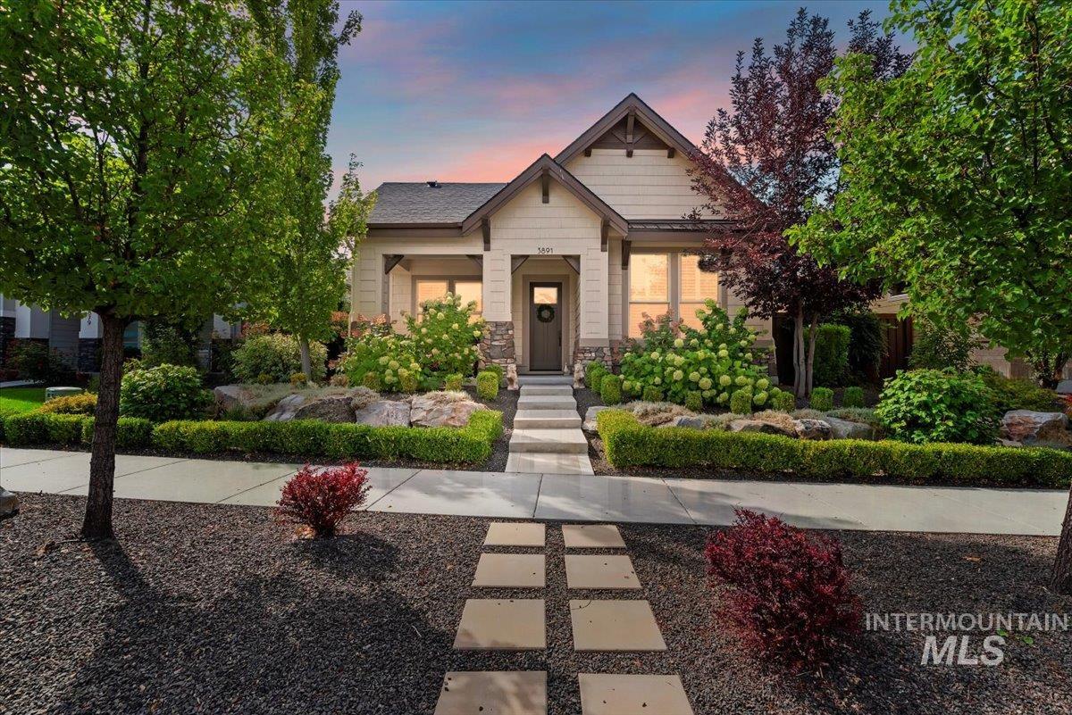 Craftsman inspired home featuring stone siding