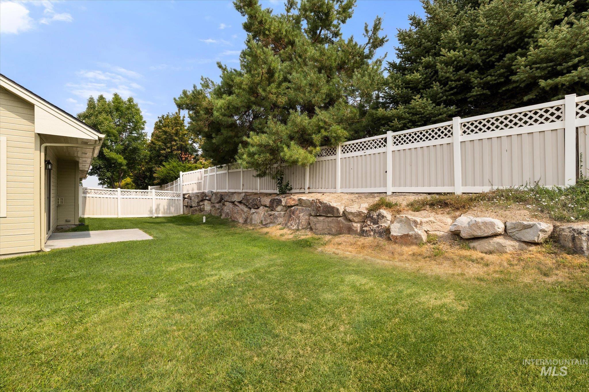 Fenced backyard featuring a patio area