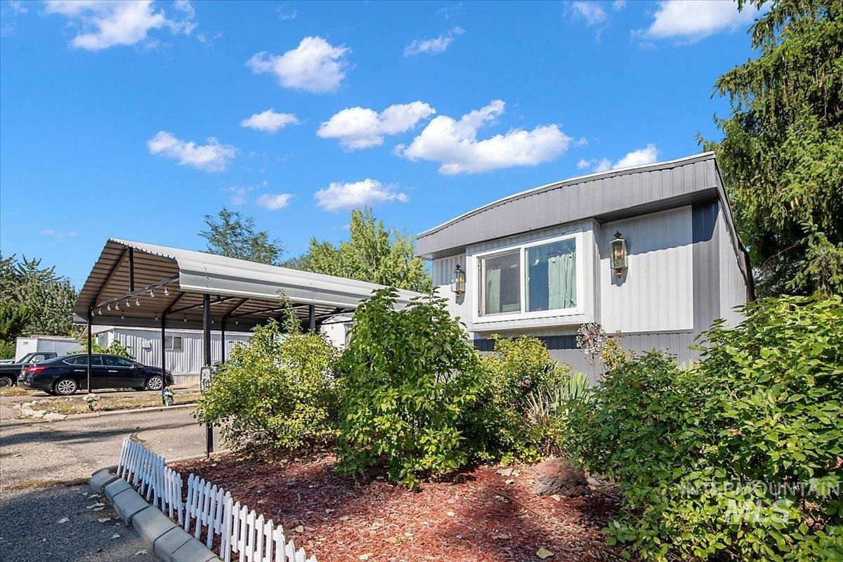View of front facade featuring a carport