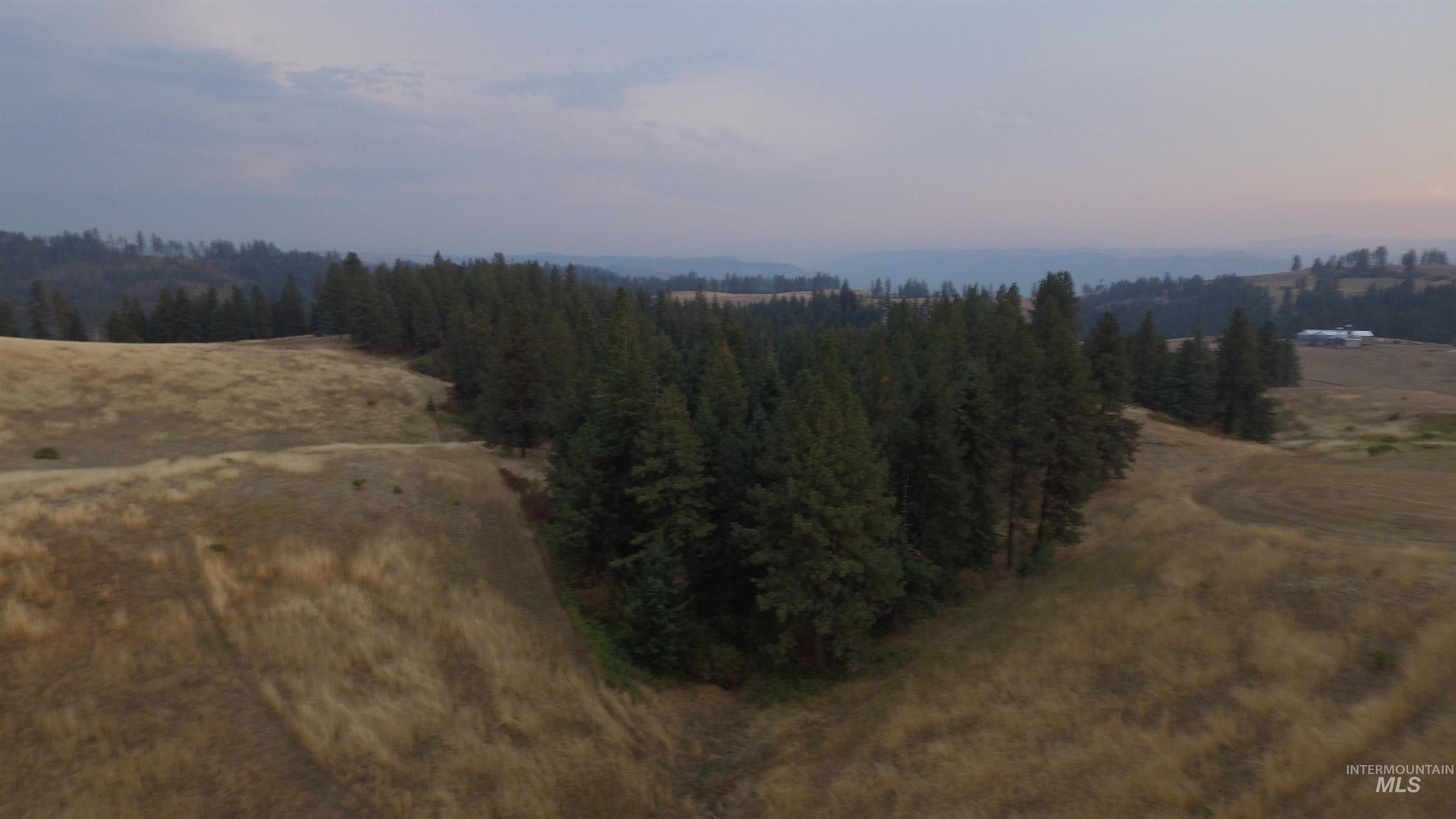Aerial view of property and surrounding area featuring rural landscape