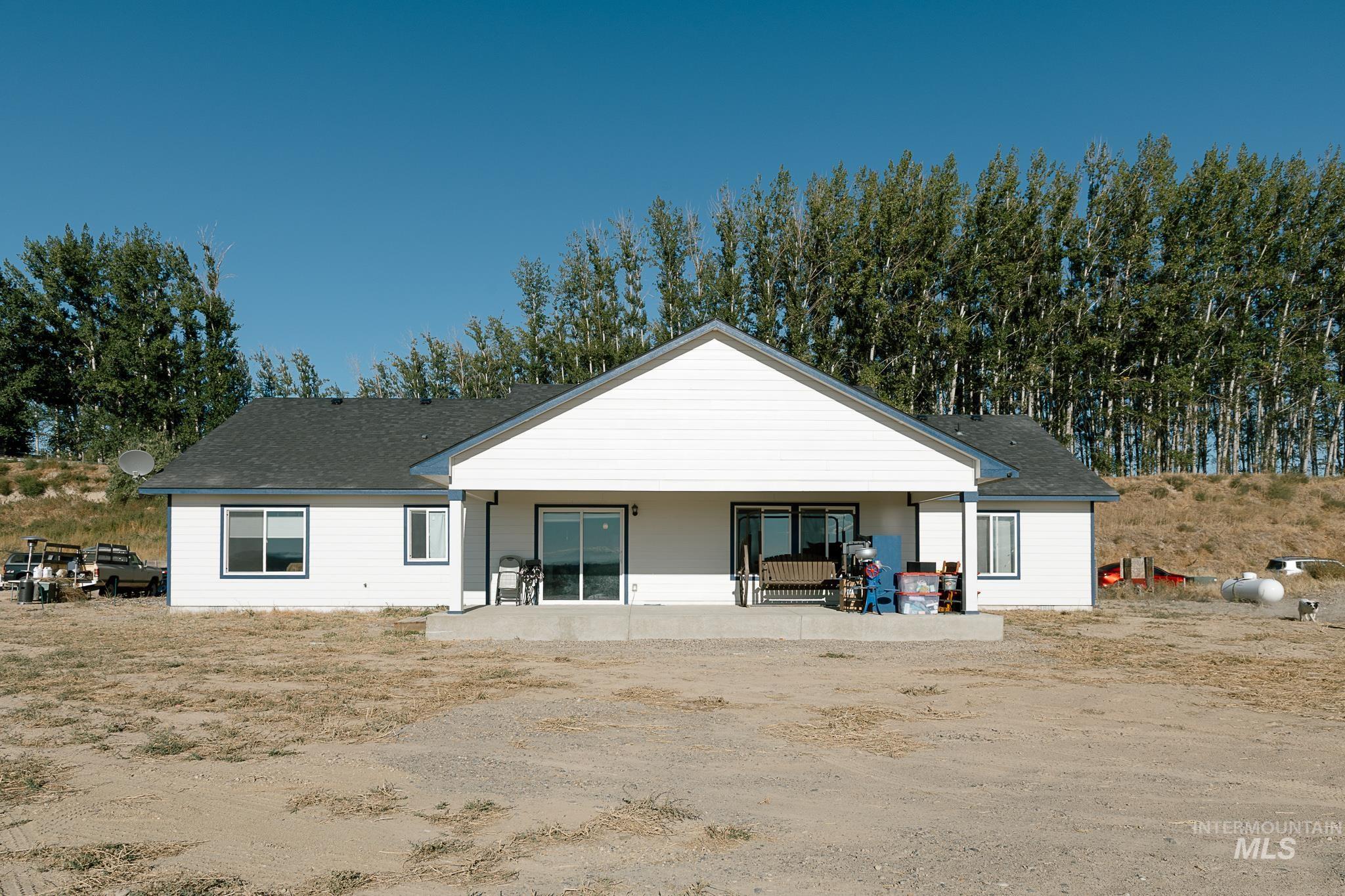 Rear view of house with roof with shingles