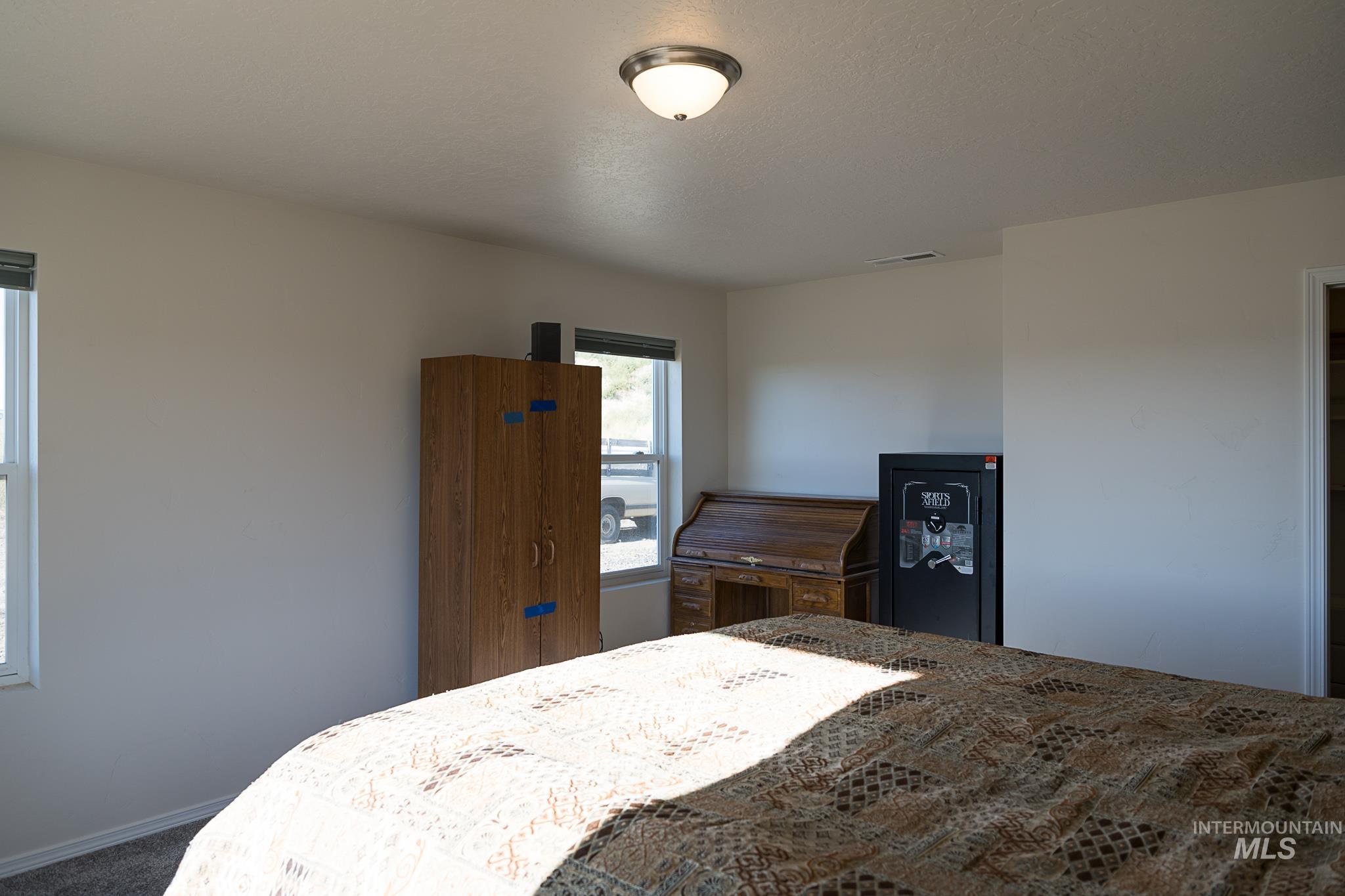 Bedroom featuring baseboards