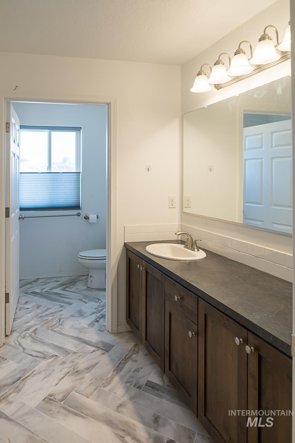 Bathroom with vanity and toilet