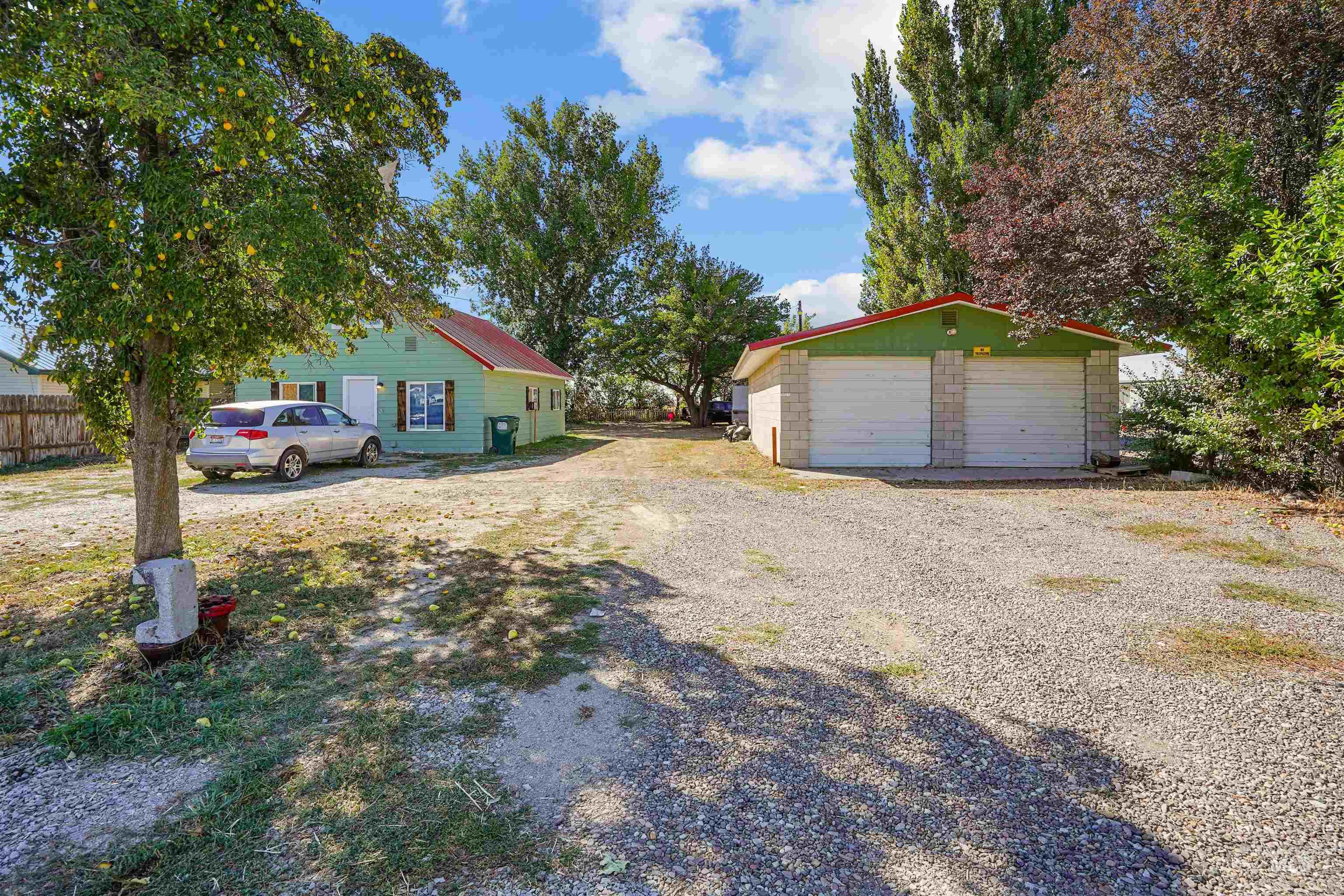 View of yard featuring an outdoor structure and a garage