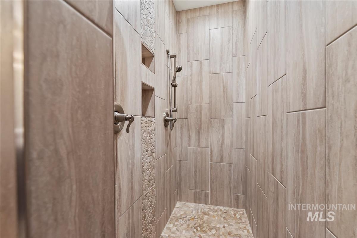 Full bathroom with a tile shower