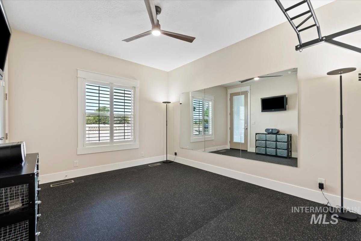 Workout room featuring plenty of natural light