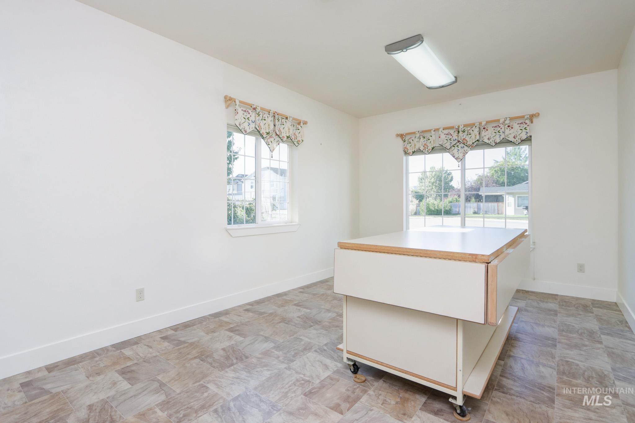 Kitchen with light countertops and a center island