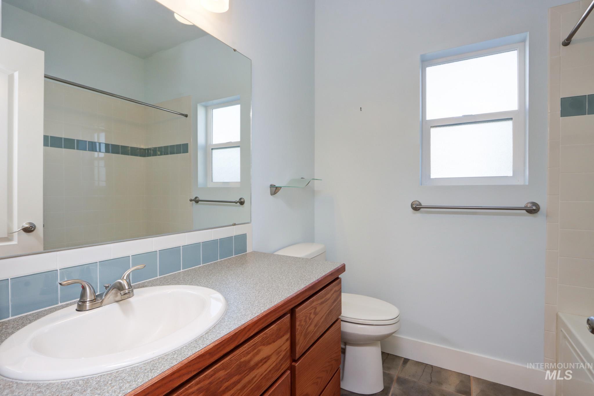 Full bathroom with vanity and bathtub / shower combination