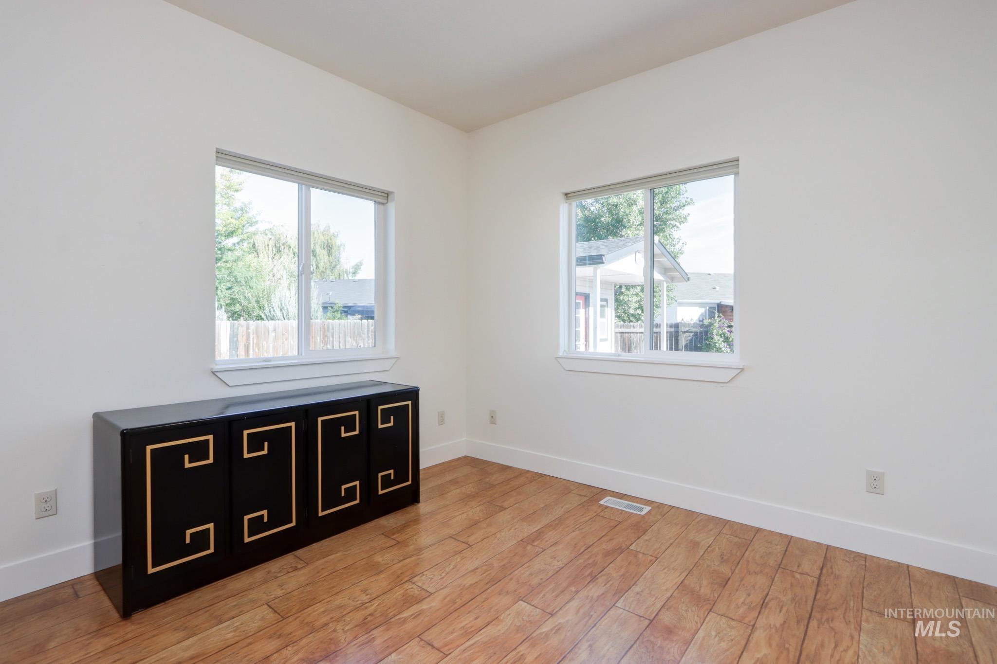 Unfurnished bedroom featuring baseboards and light wood finished floors