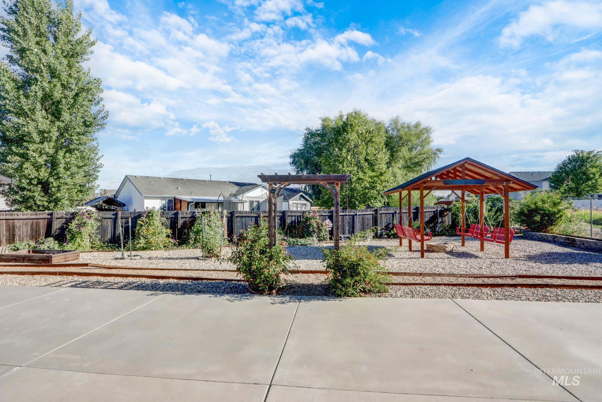 Community jungle gym with a patio area