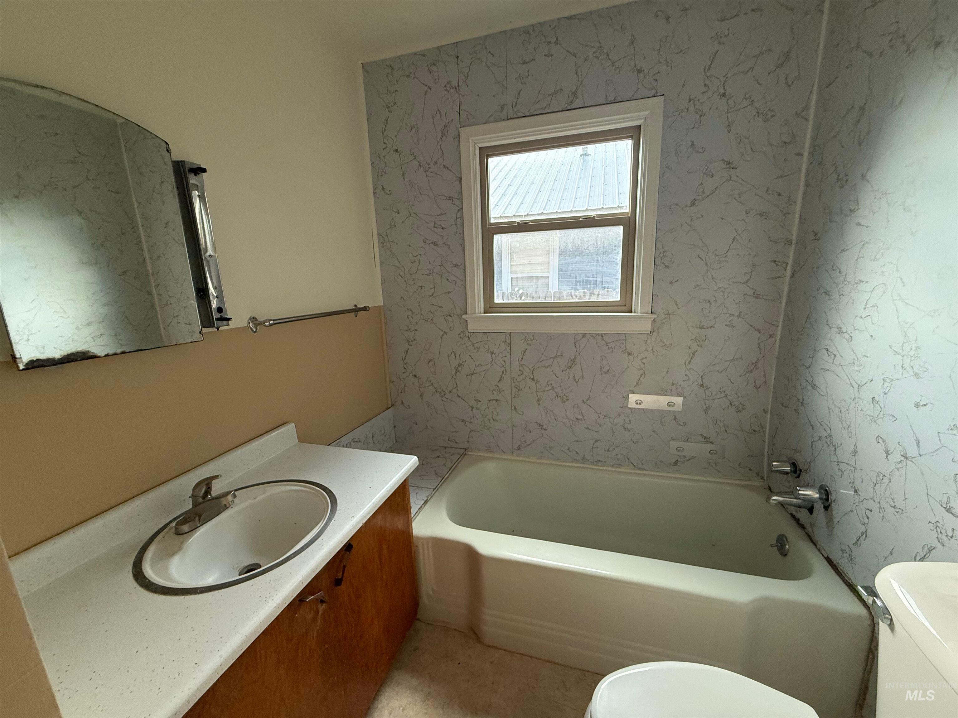 Full bath featuring vanity and tub / shower combination