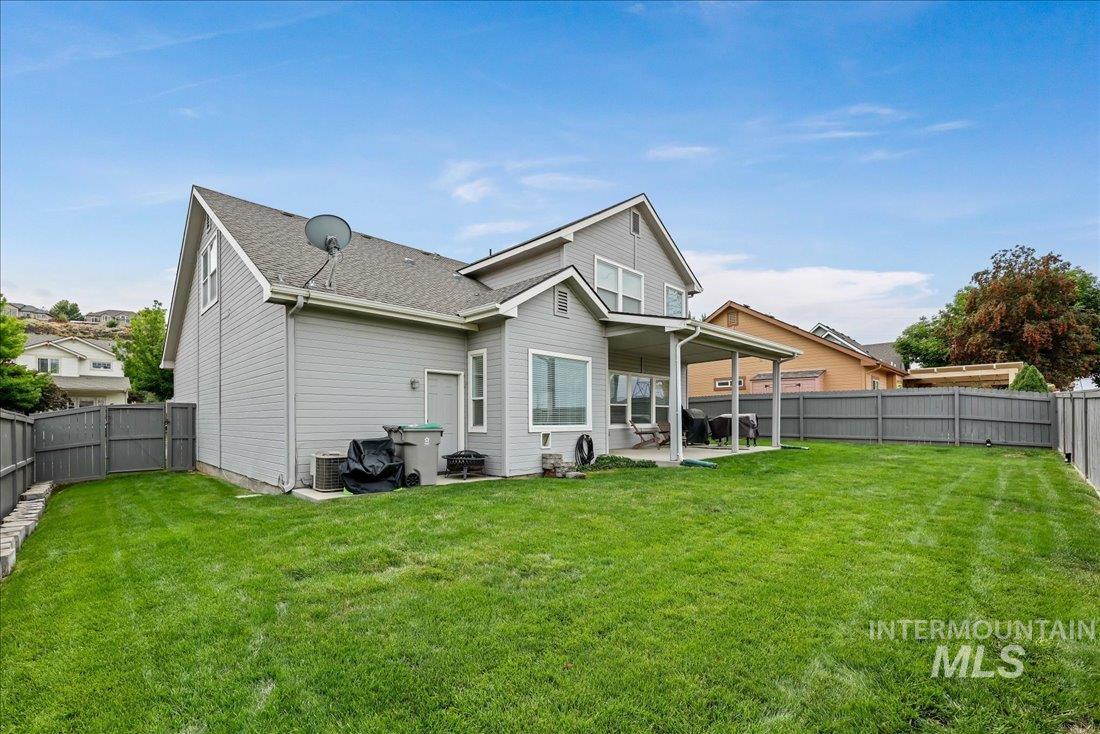 Back of house featuring a patio and a fenced backyard