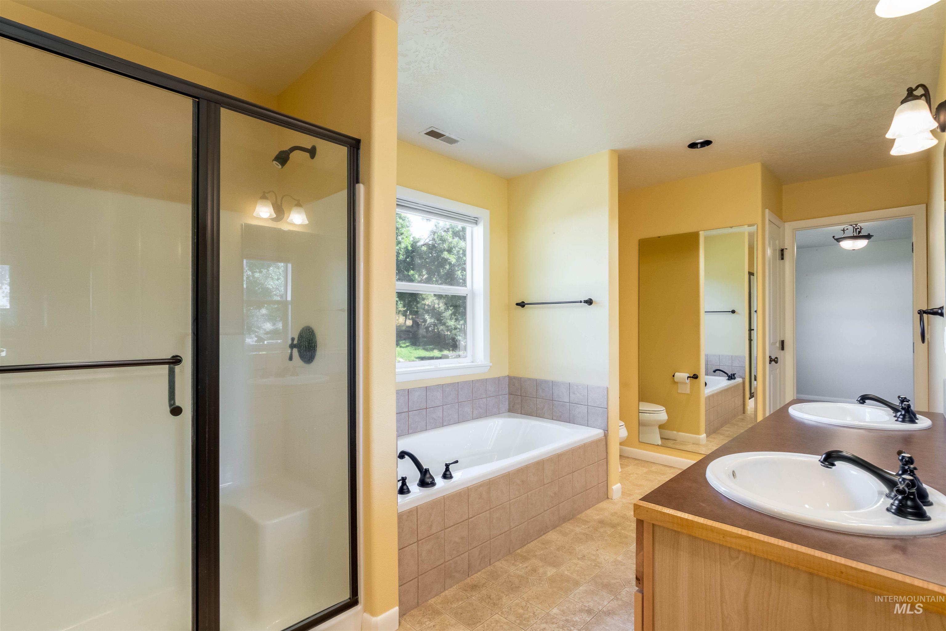 Full bath with walk in shower, double vanity, master closet