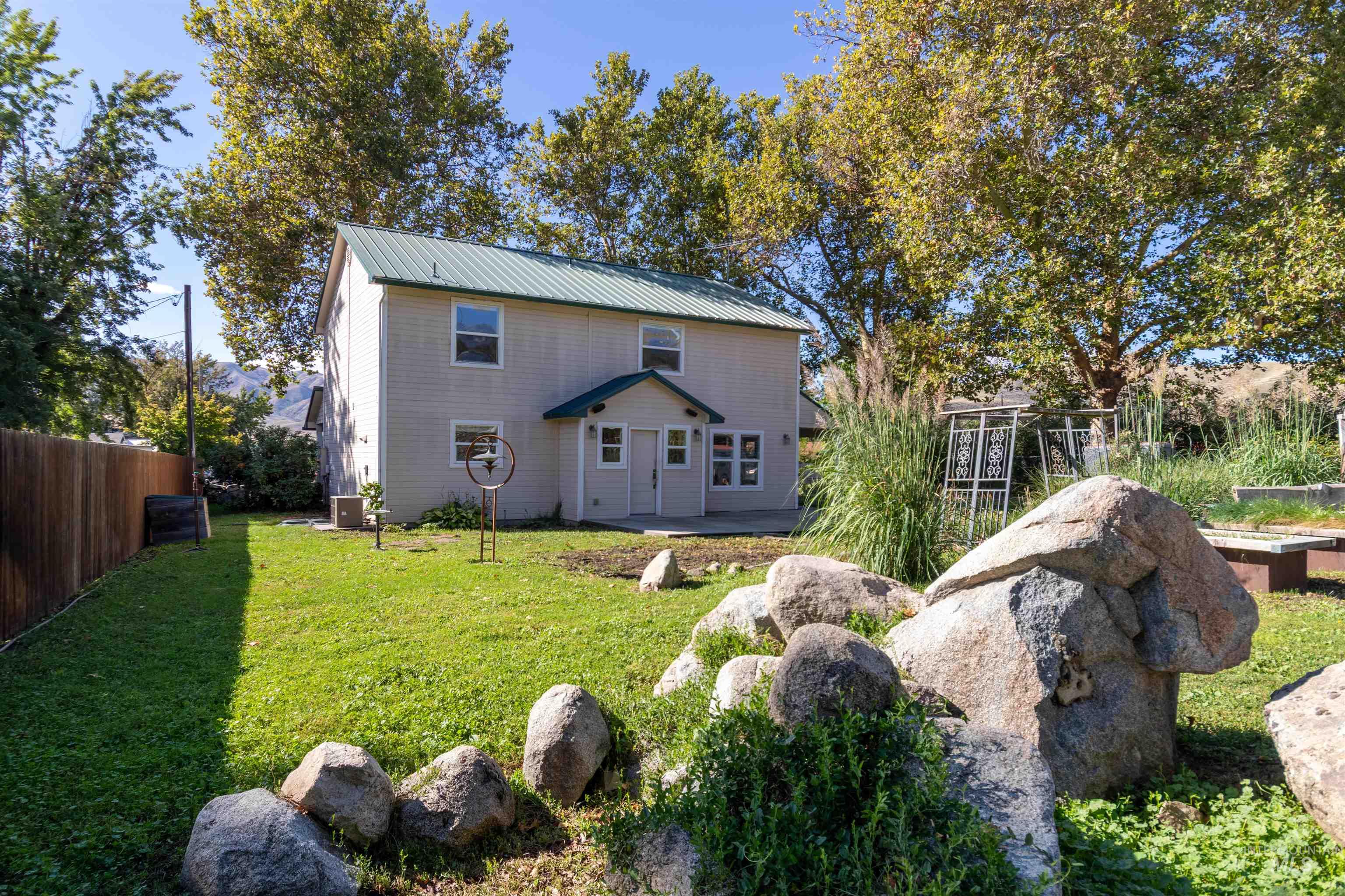 Back of property with a metal roof
