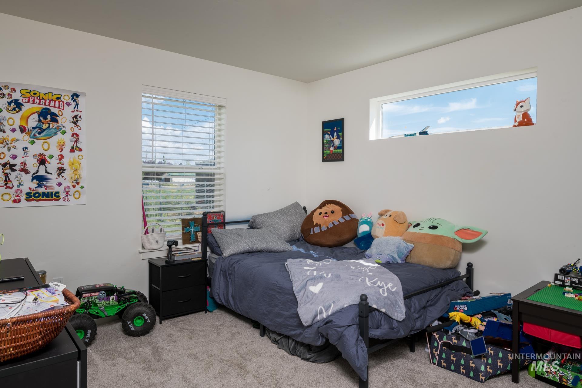 Bedroom featuring carpet floors