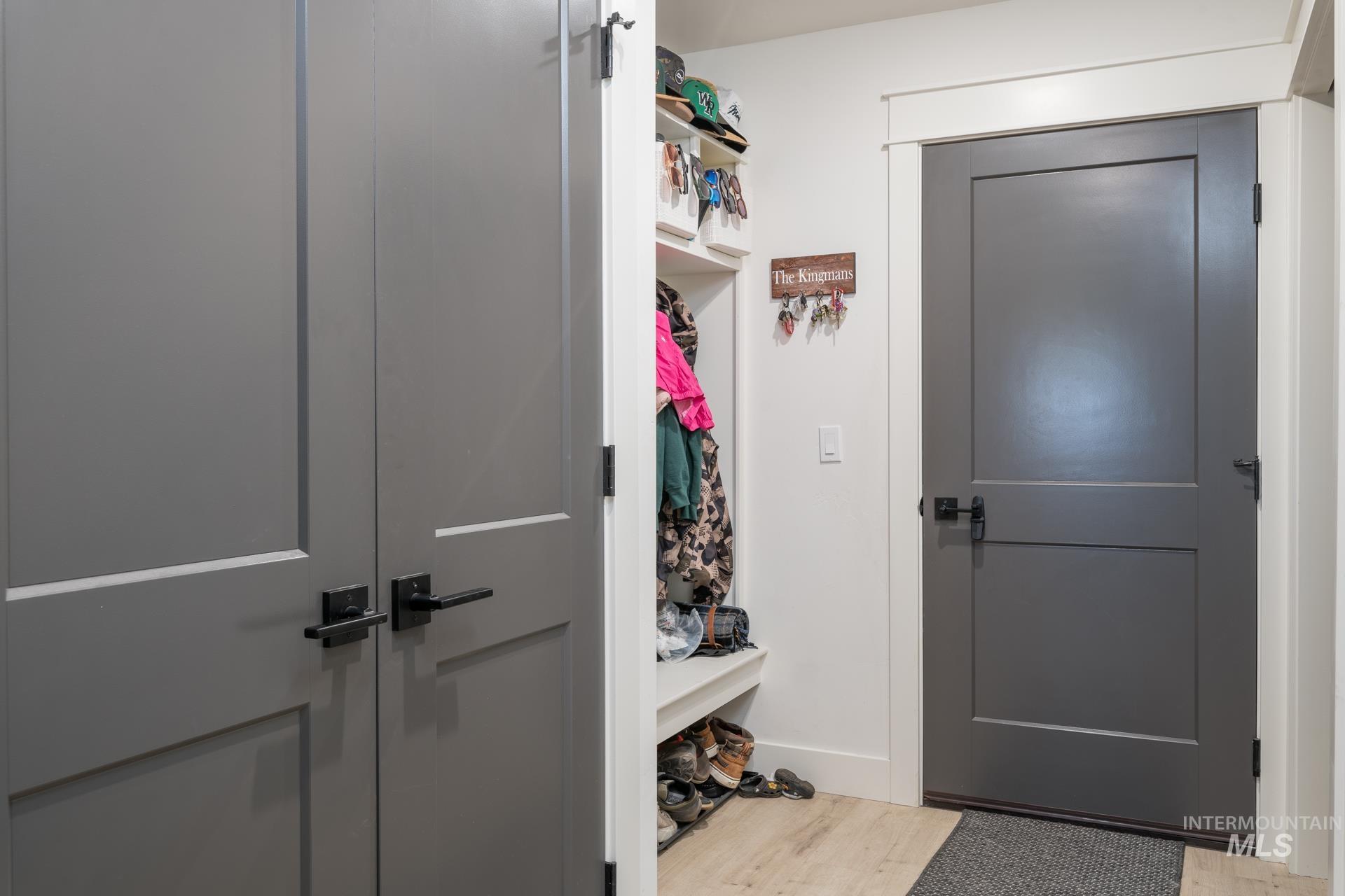 Mudroom featuring light wood-style flooring