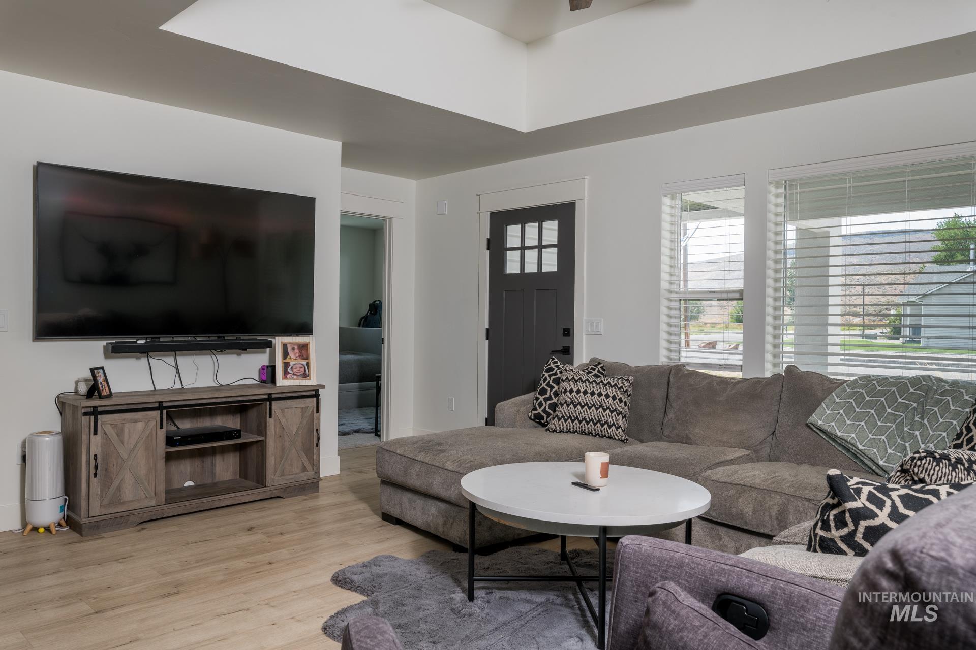 Living area with light wood-style floors