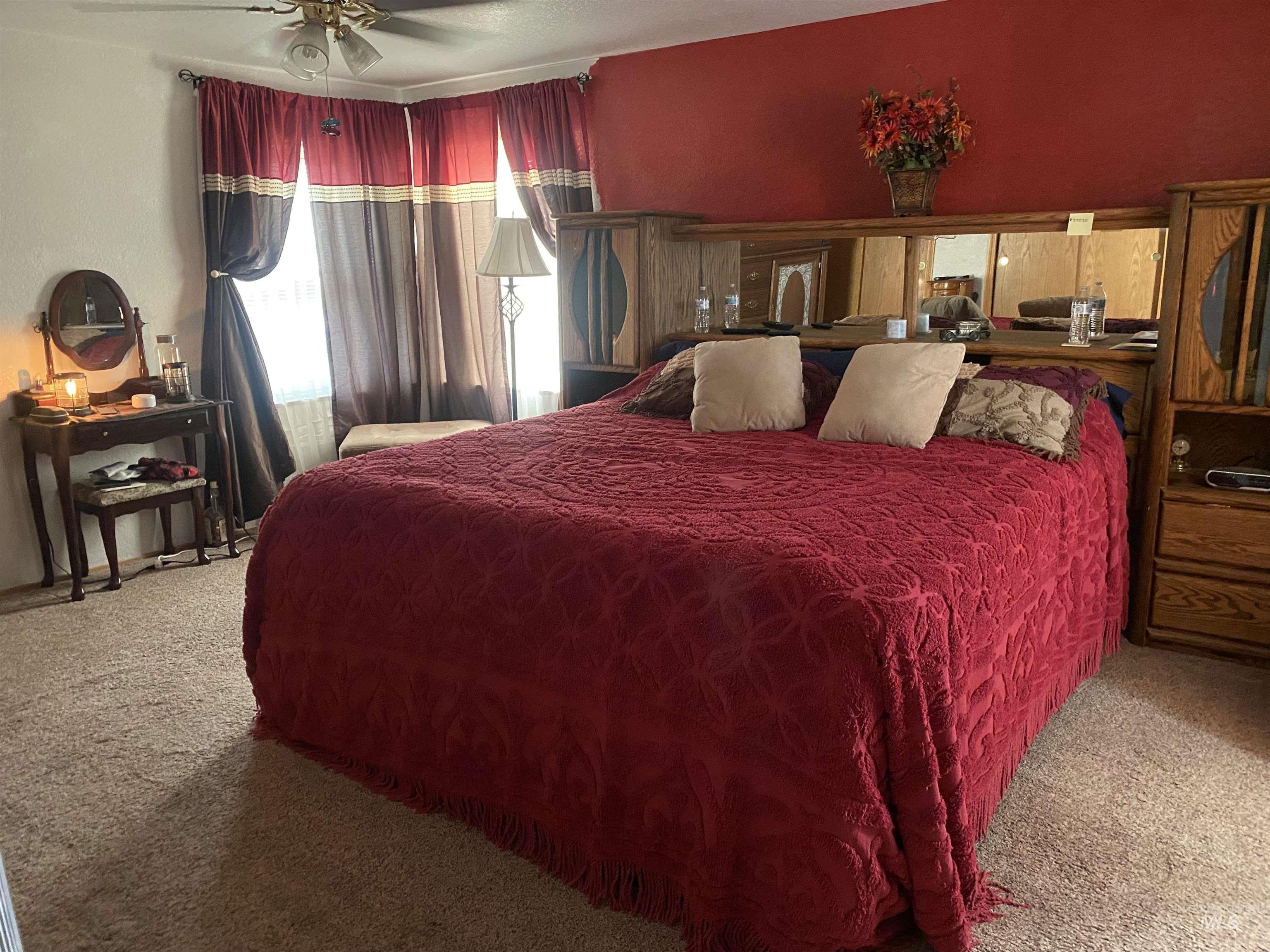 Bedroom with carpet flooring and ceiling fan
