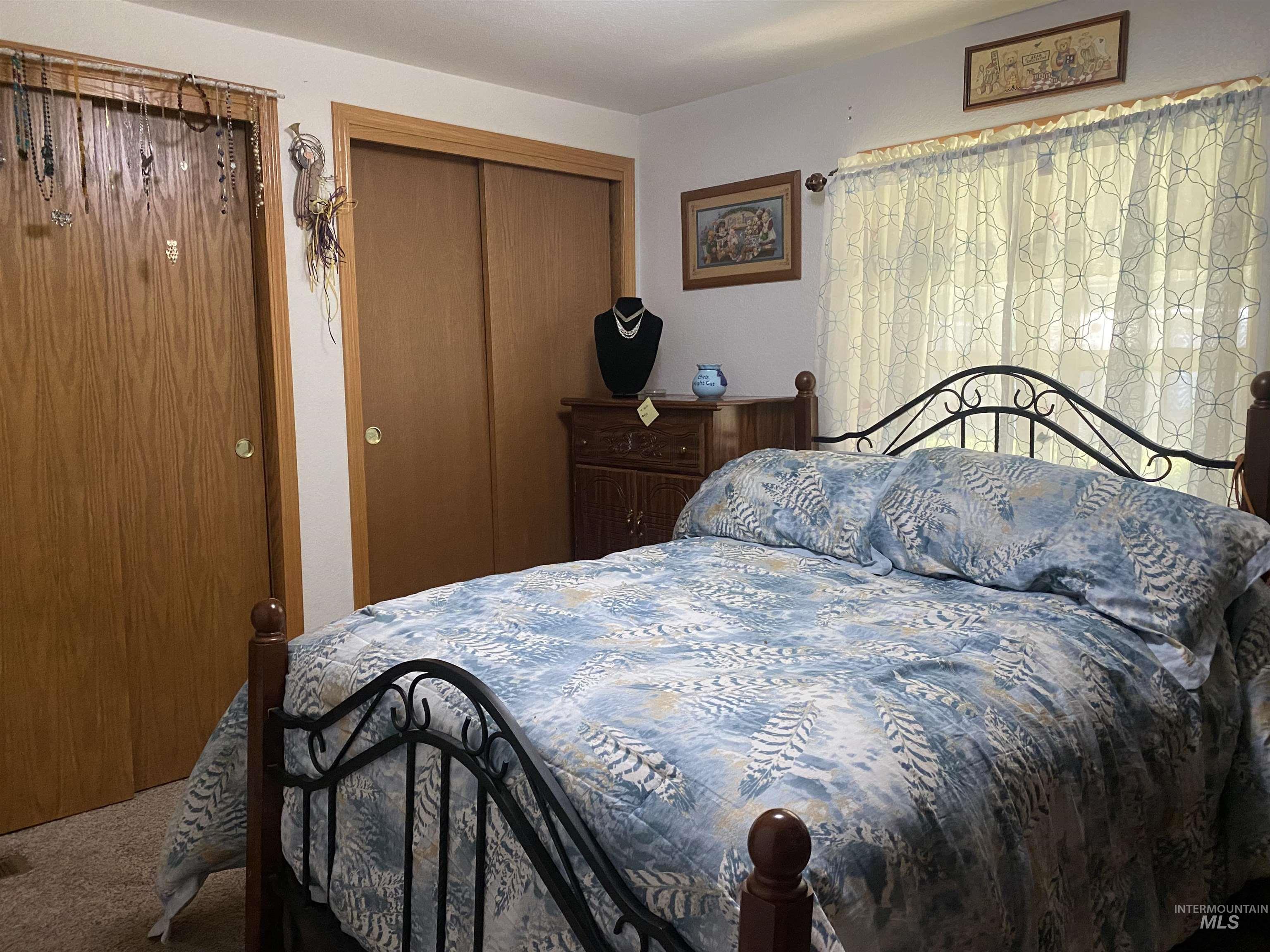 Bedroom featuring a closet and carpet
