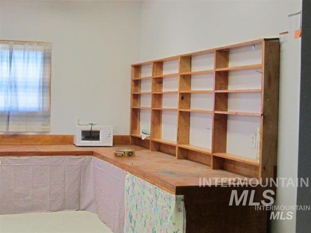 Interior space featuring white microwave