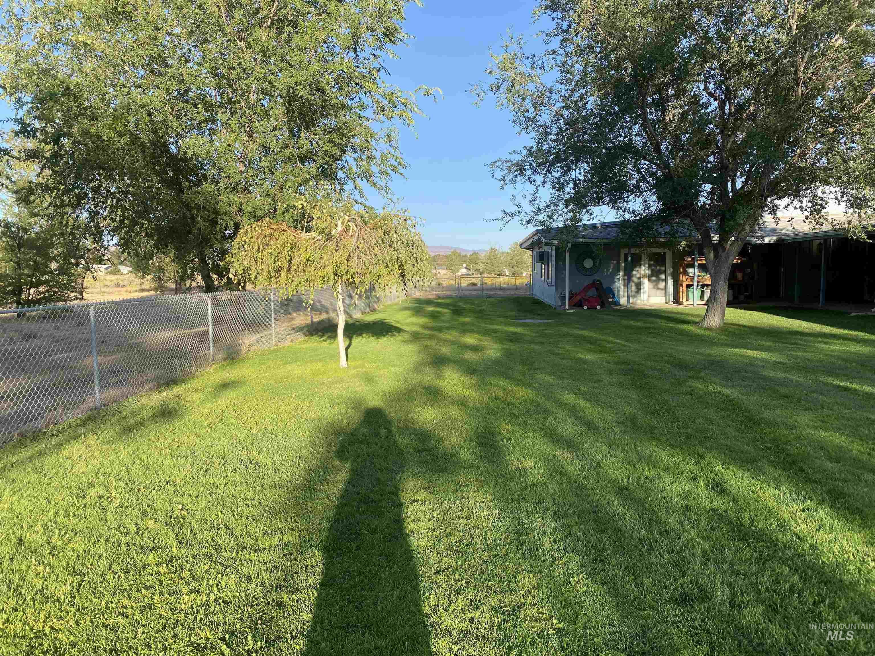 View of fenced backyard