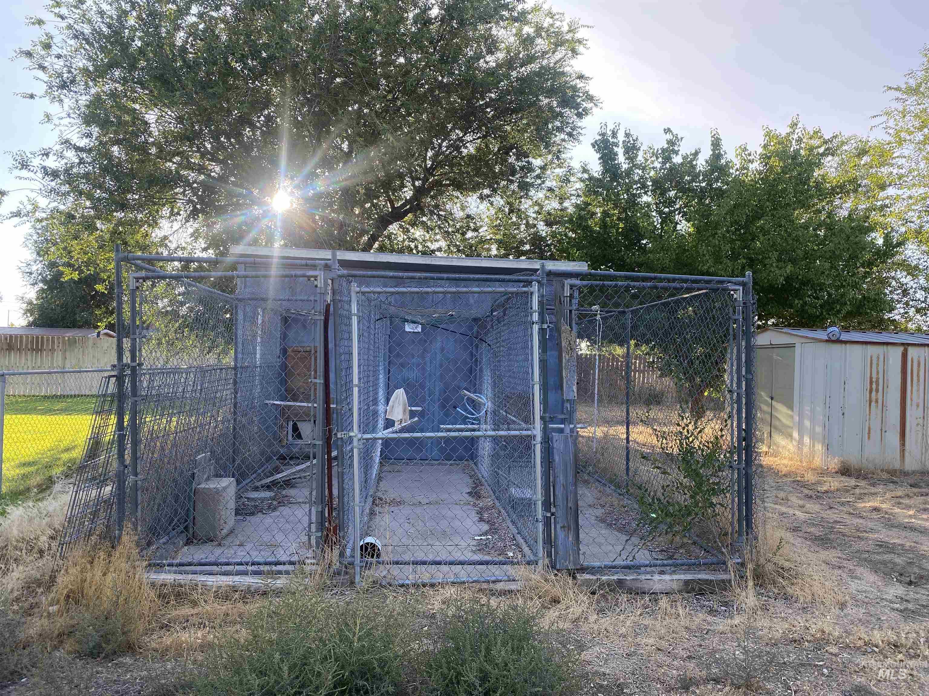 Gate featuring an outbuilding and an exterior structure