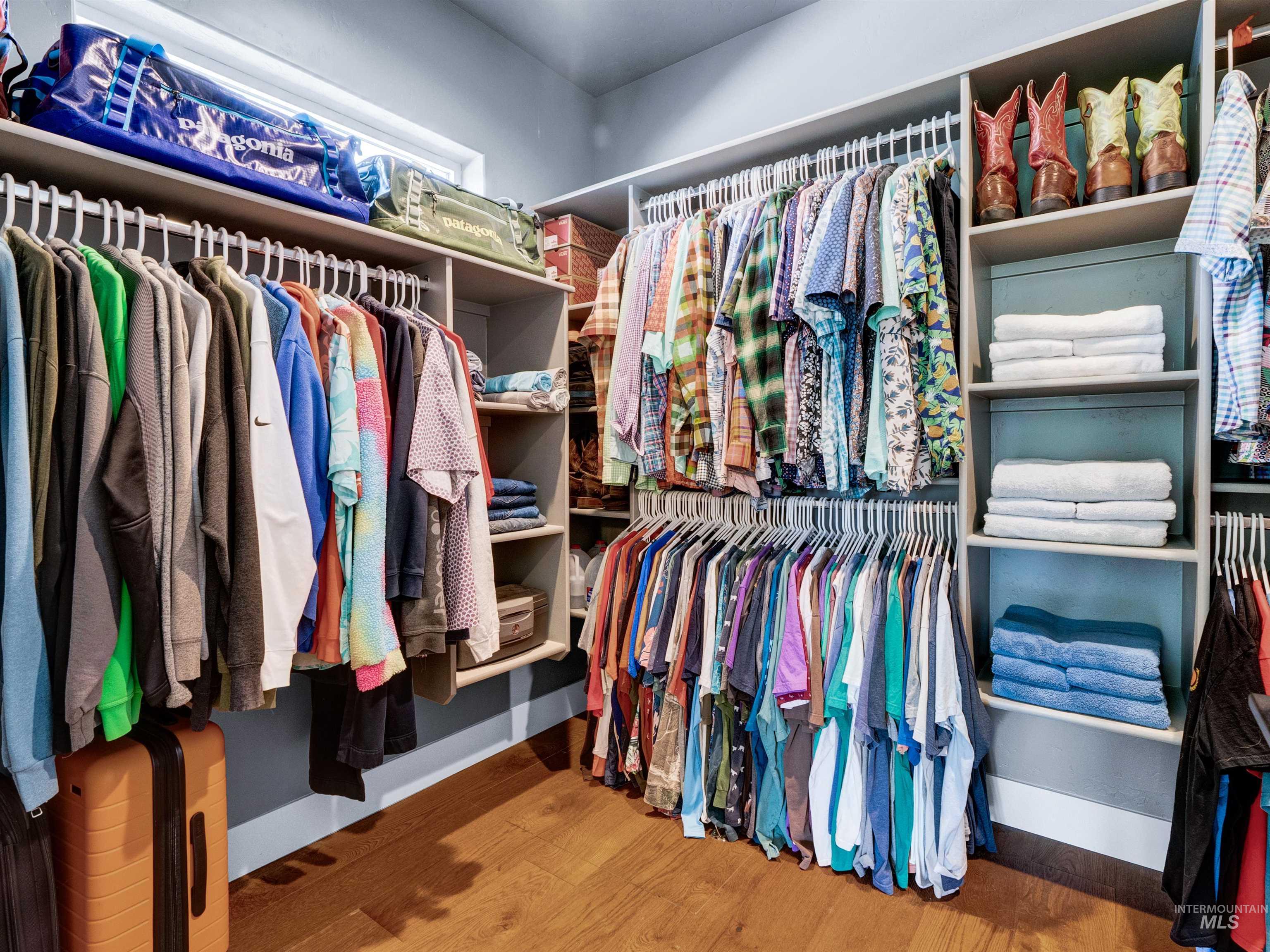 Spacious closet featuring wood finished floors