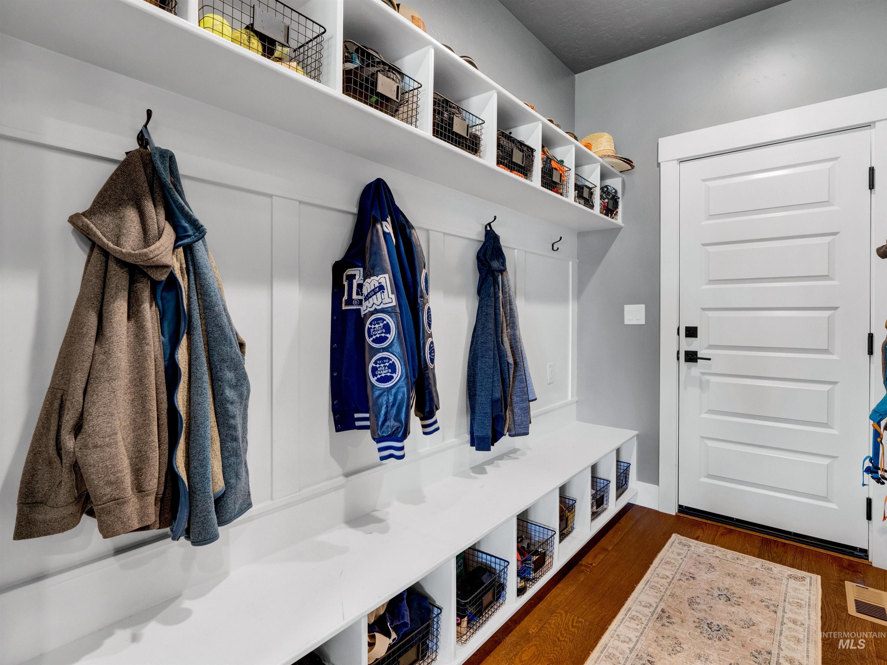 Mudroom featuring dark wood-type flooring