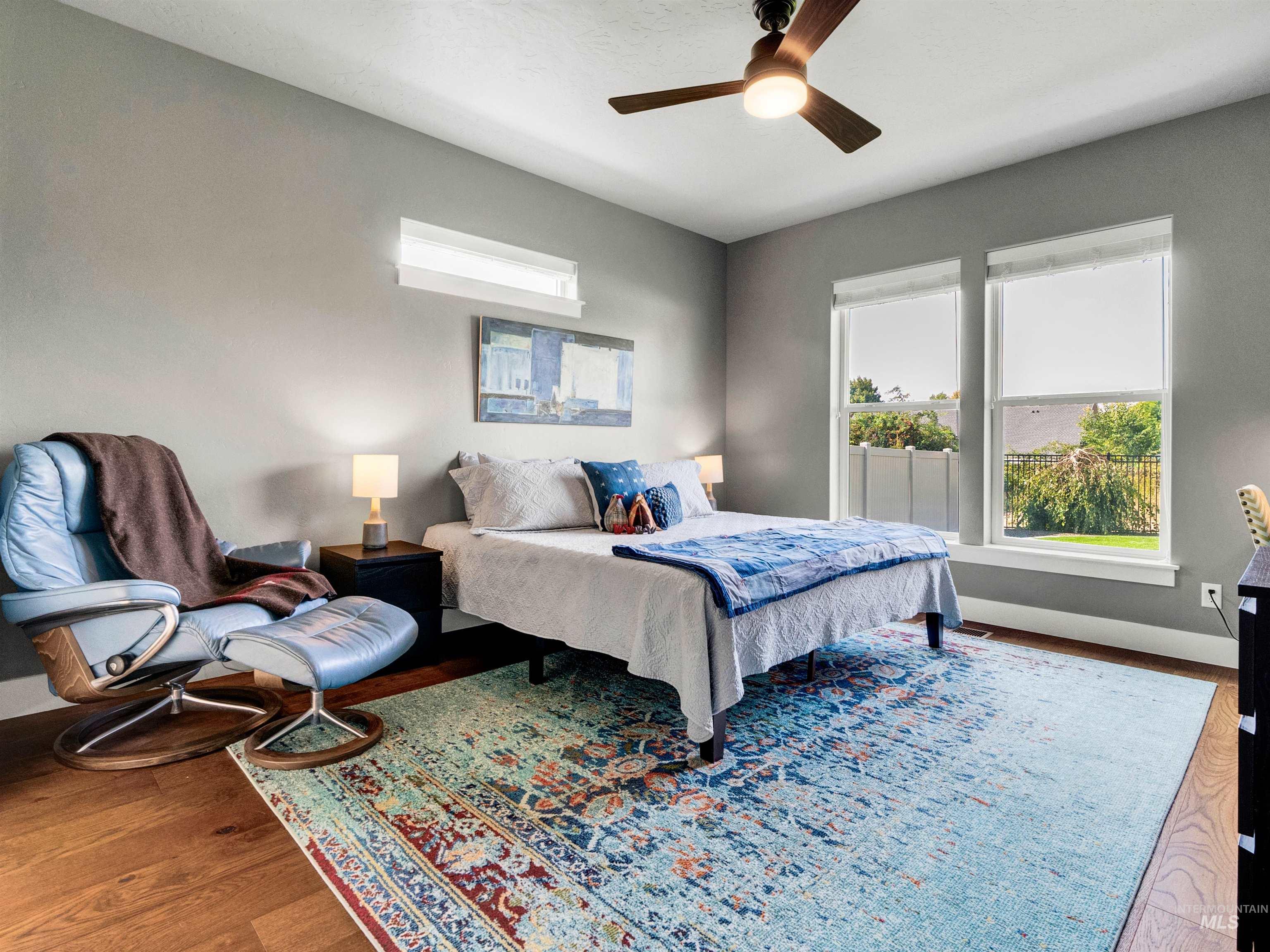 Bedroom featuring wood finished floors and ceiling fan