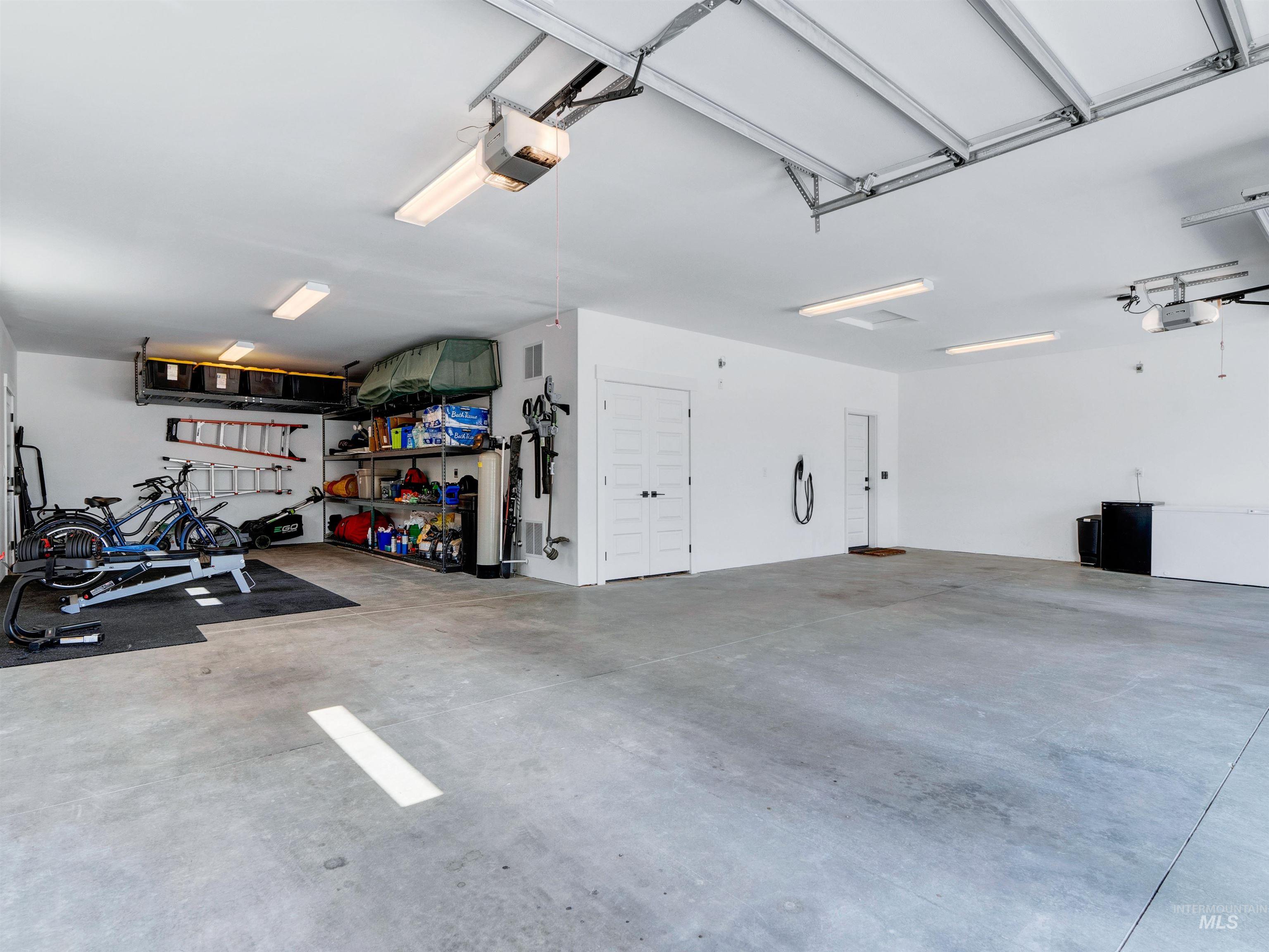 Garage featuring a garage door opener