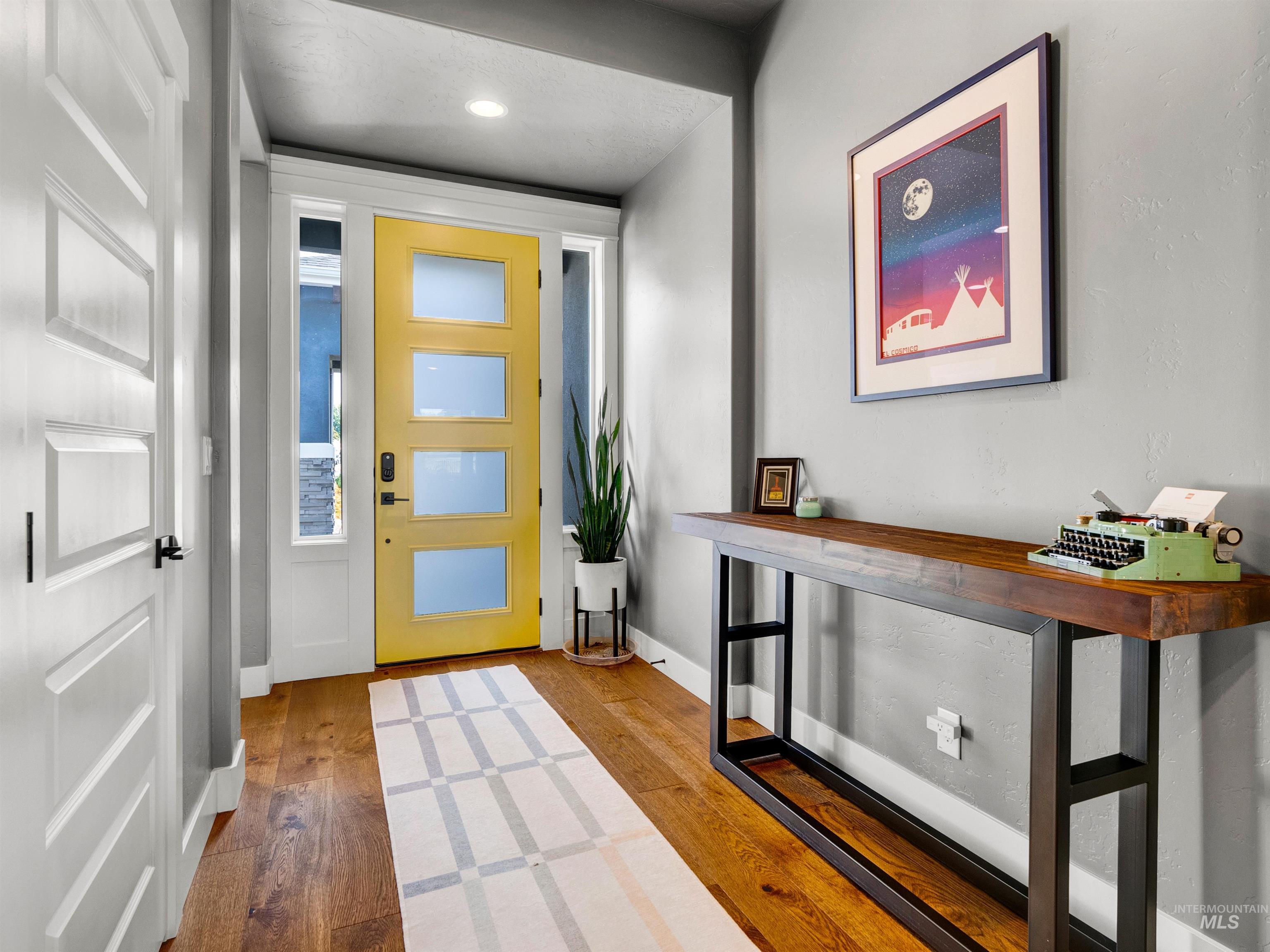 Entrance foyer featuring wood finished floors
