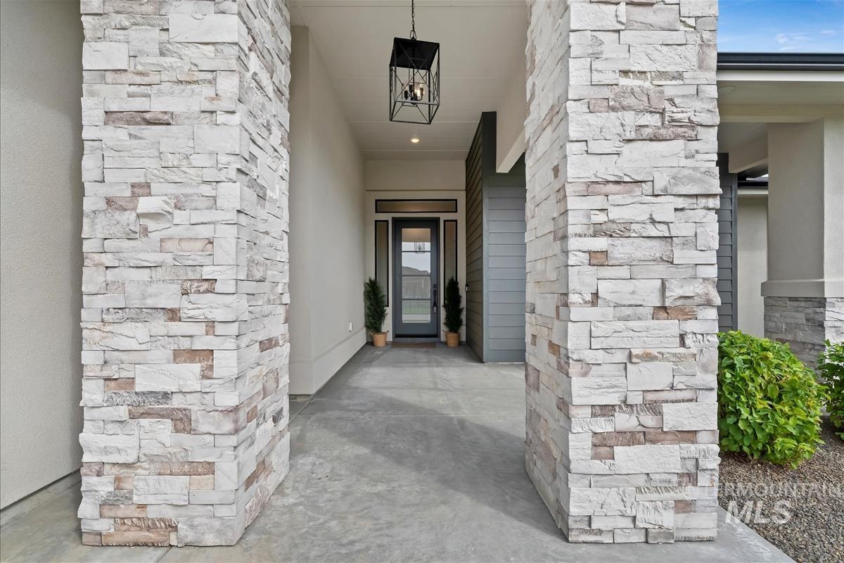 Property entrance featuring stucco siding