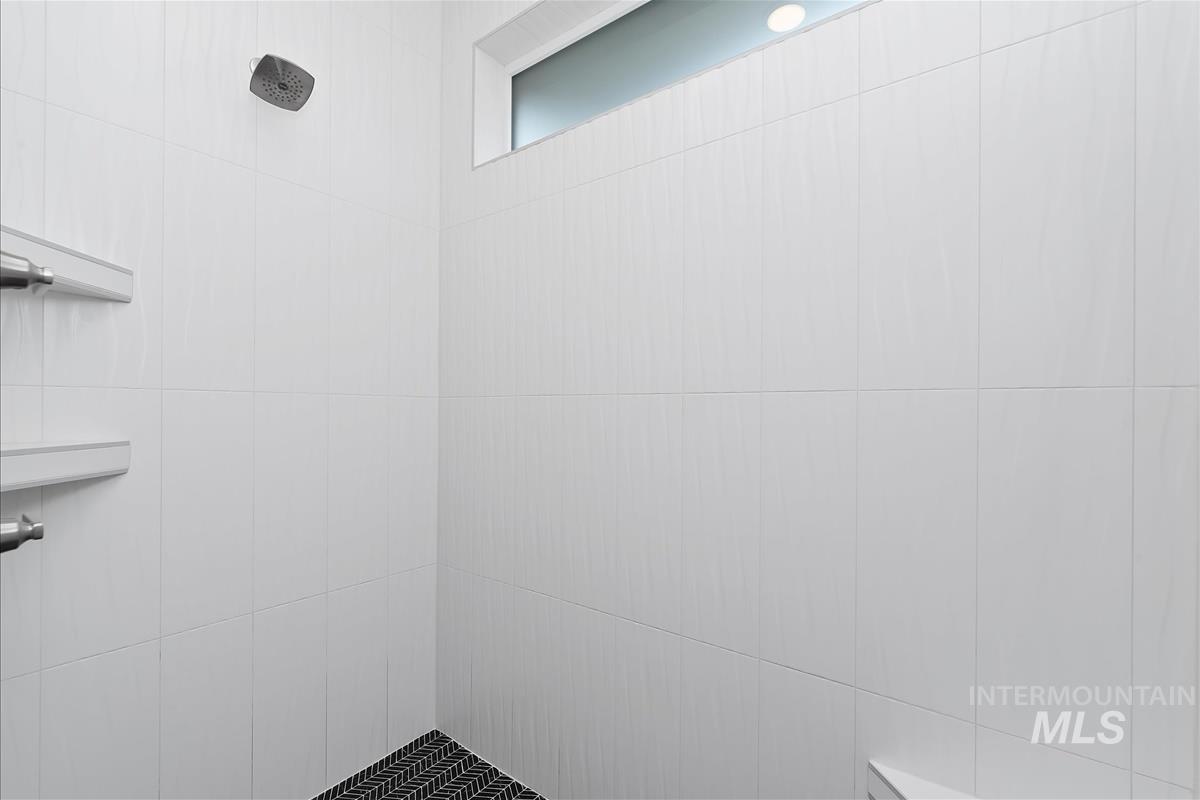 Bathroom with tiled shower