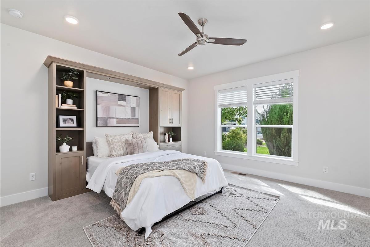 Bedroom featuring carpet flooring, a ceiling fan, and recessed lighting