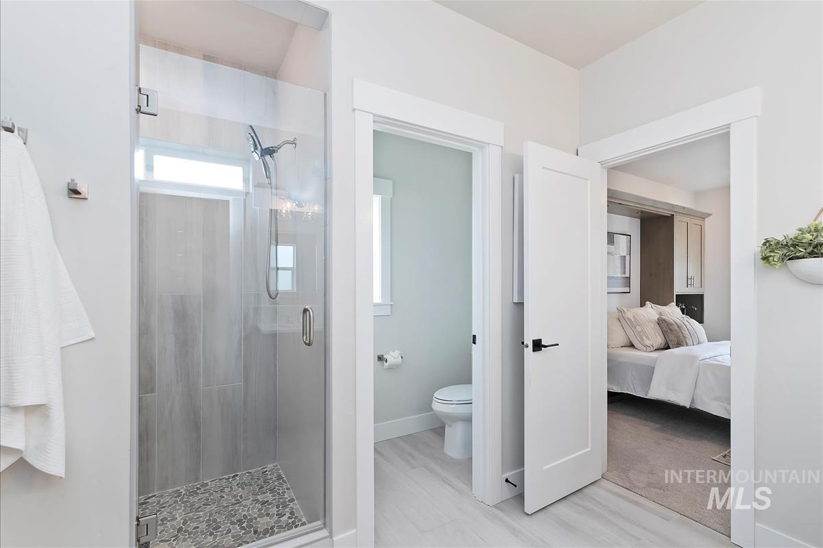Bathroom with a stall shower and ensuite bath